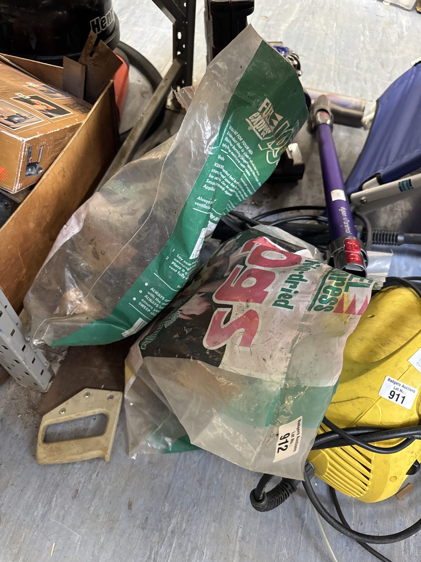 2 bags of fuel express kiln dried logs - 1 bag is part used, about half full