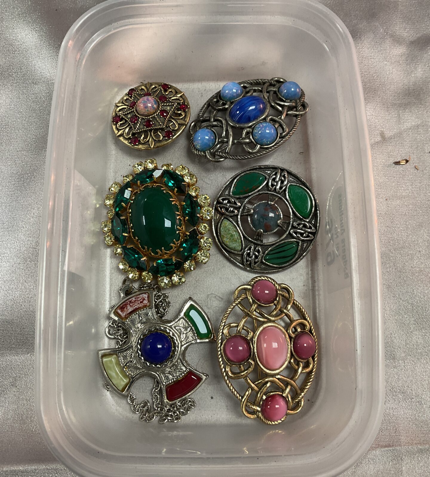Five vintage brooches and pendant necklace inc miracle