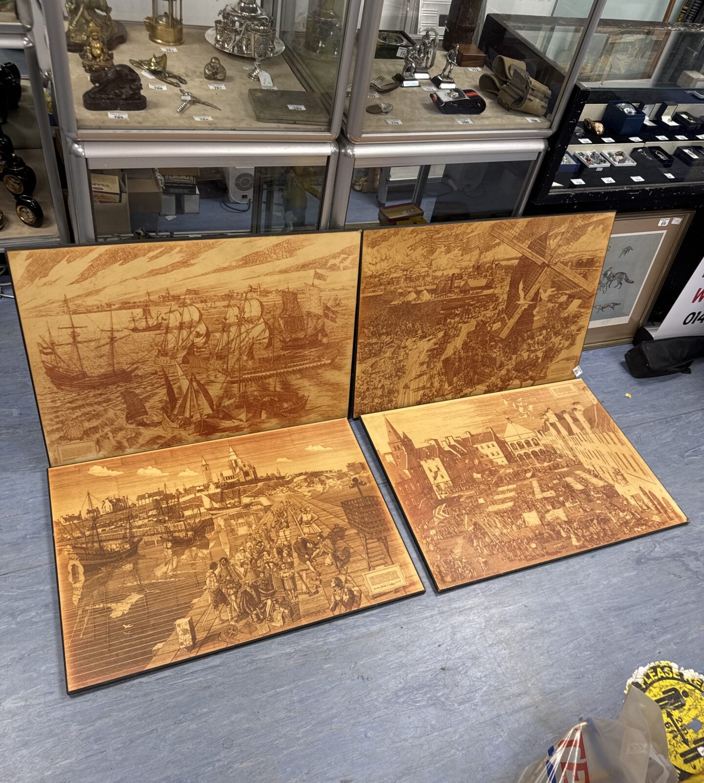 Four large prints on board of medieval harbour & town scenes