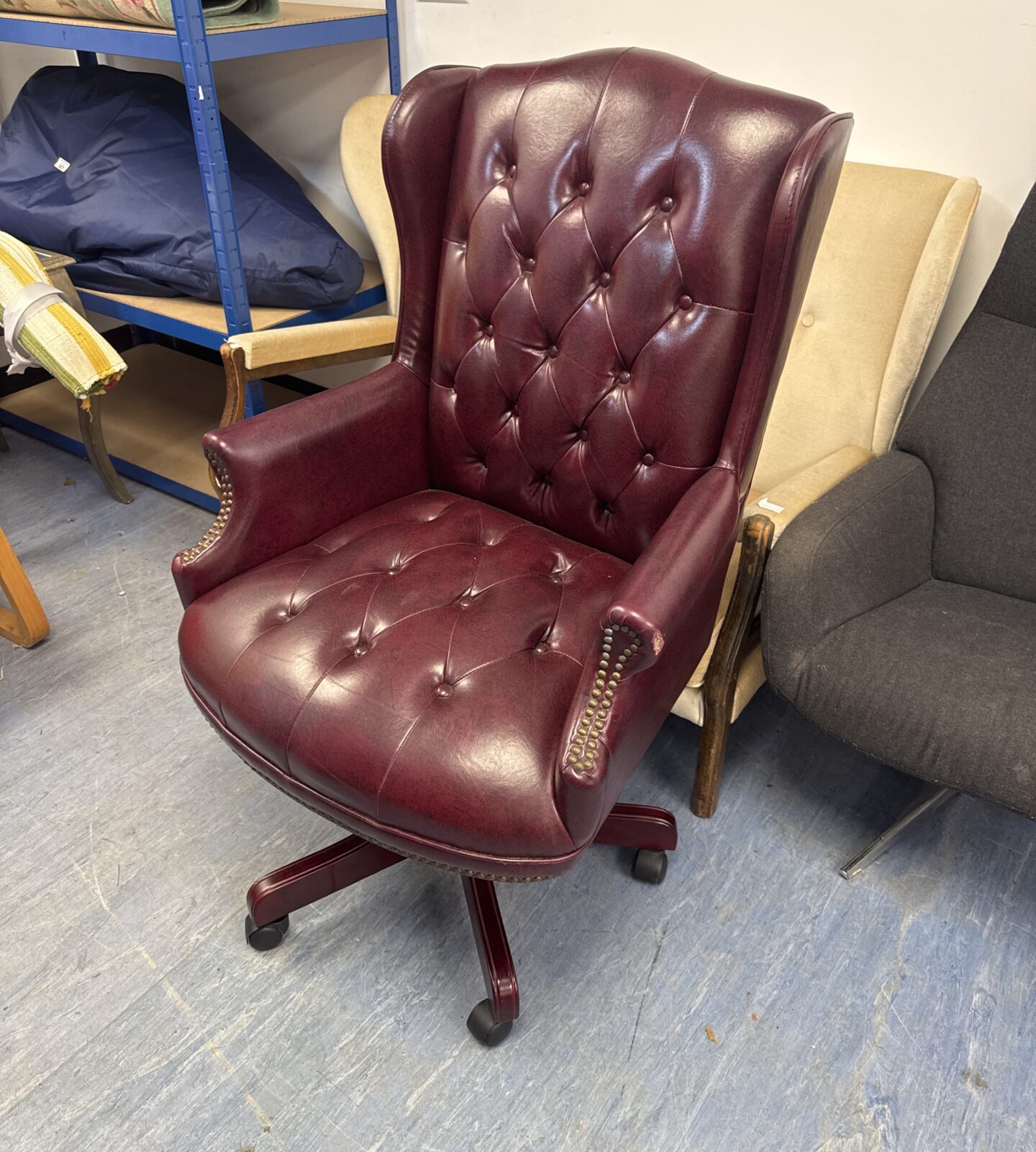 Studded faux leather chesterfield style office chair - has pet nibble mark on left arm