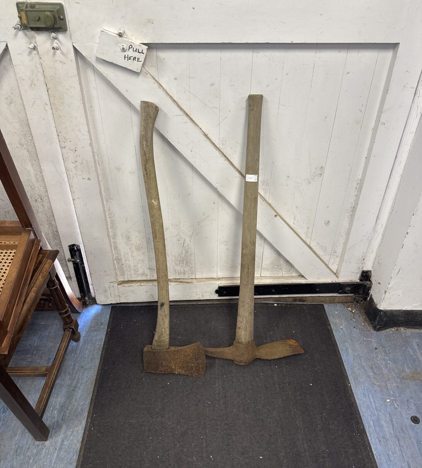 Large vintage wood axe with a mattock