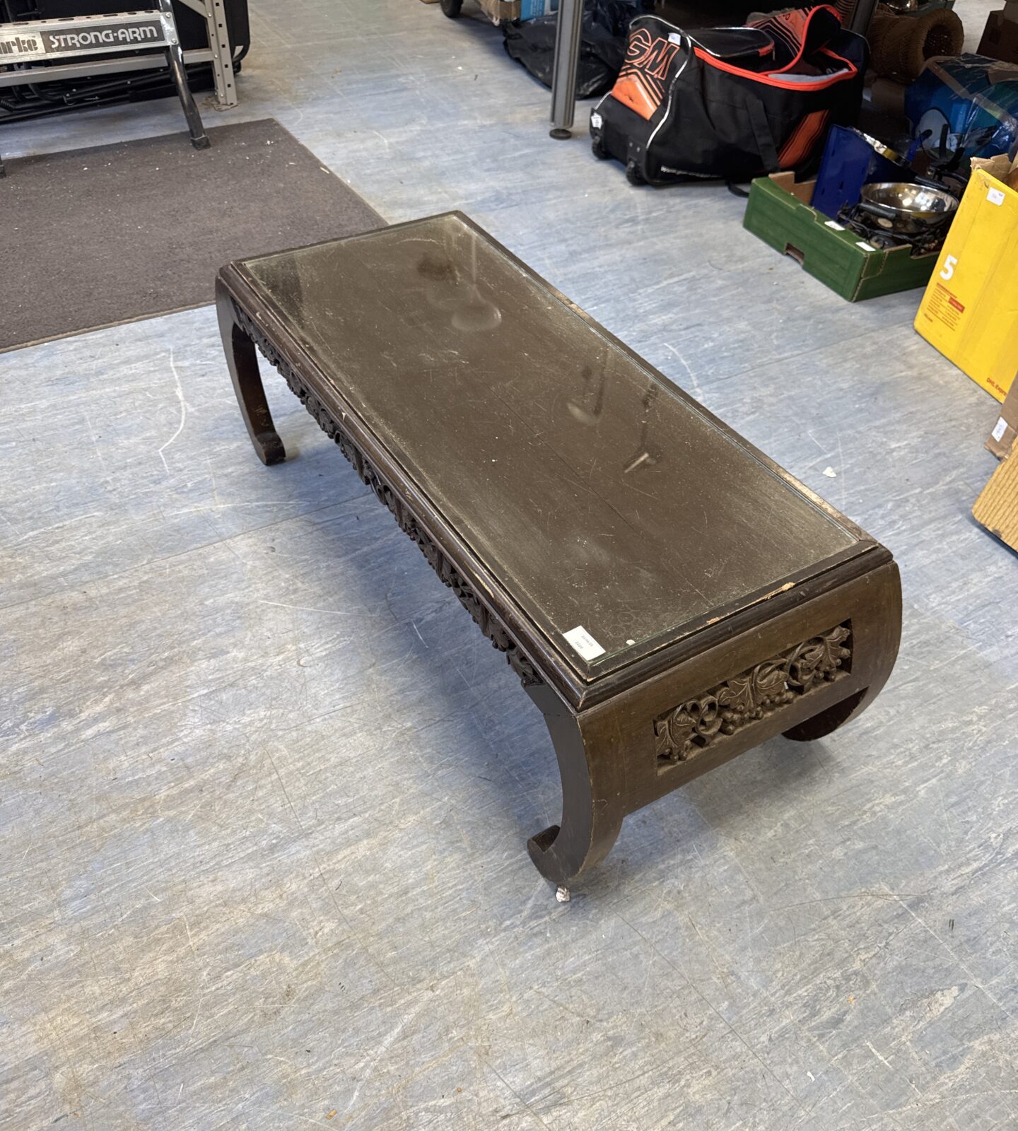 Vintage mid century oriental carved wood glass topped coffee table 39.5” length at furthest points