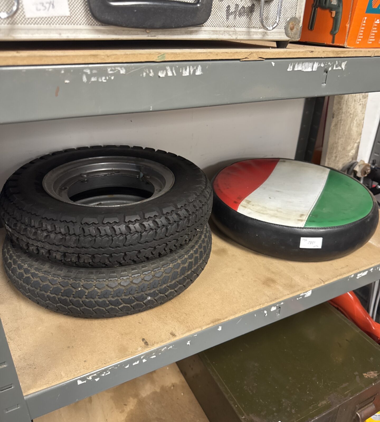 Three vintage 8” Vespa scooter wheels with an Italian flag spare wheel cover