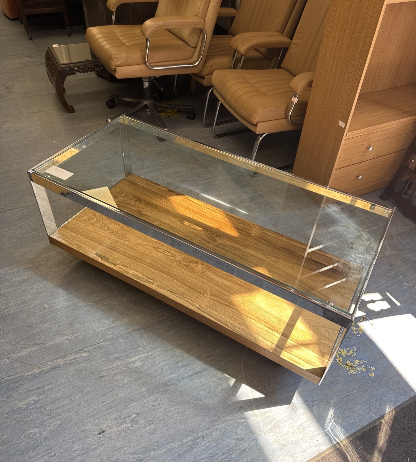 Glass topped coffee table with chrome framework