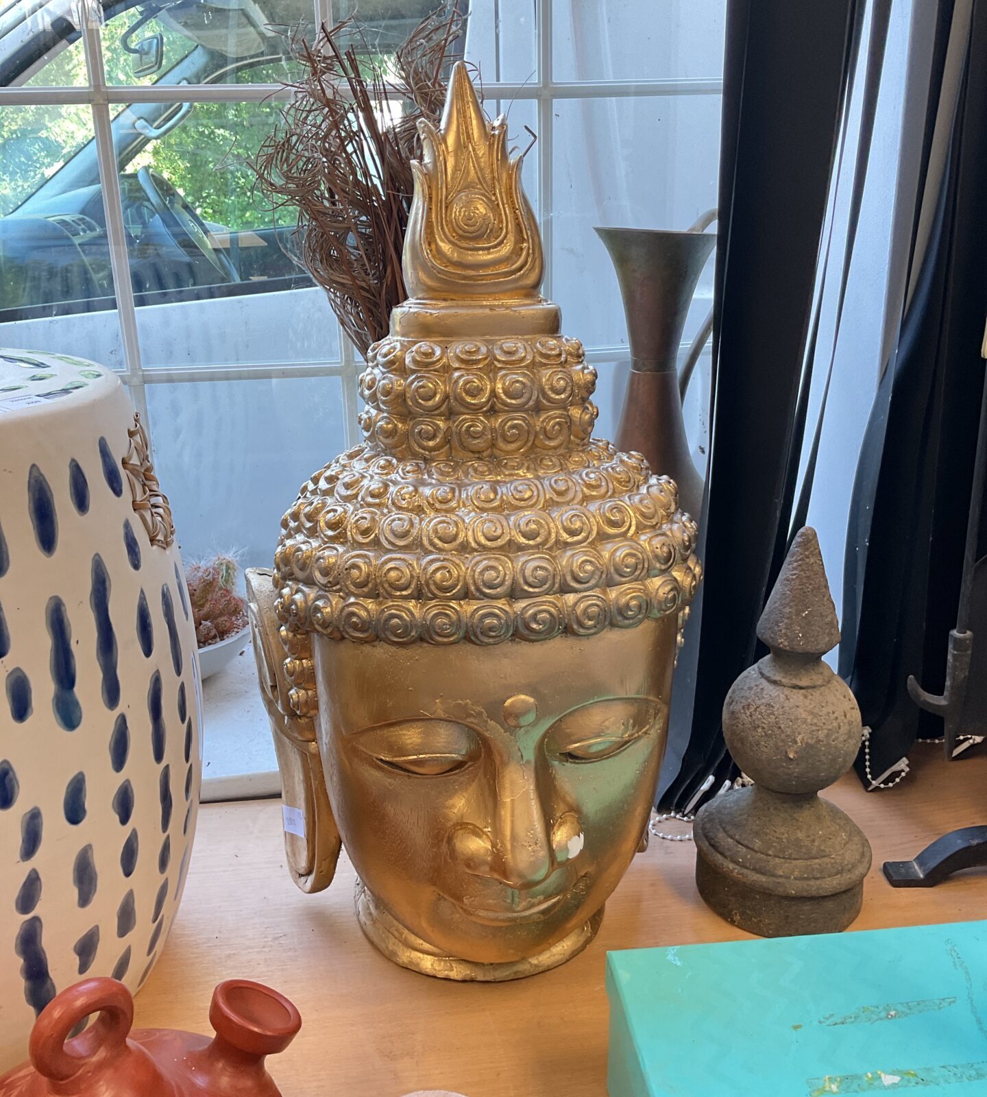 Large gold coloured buddha head