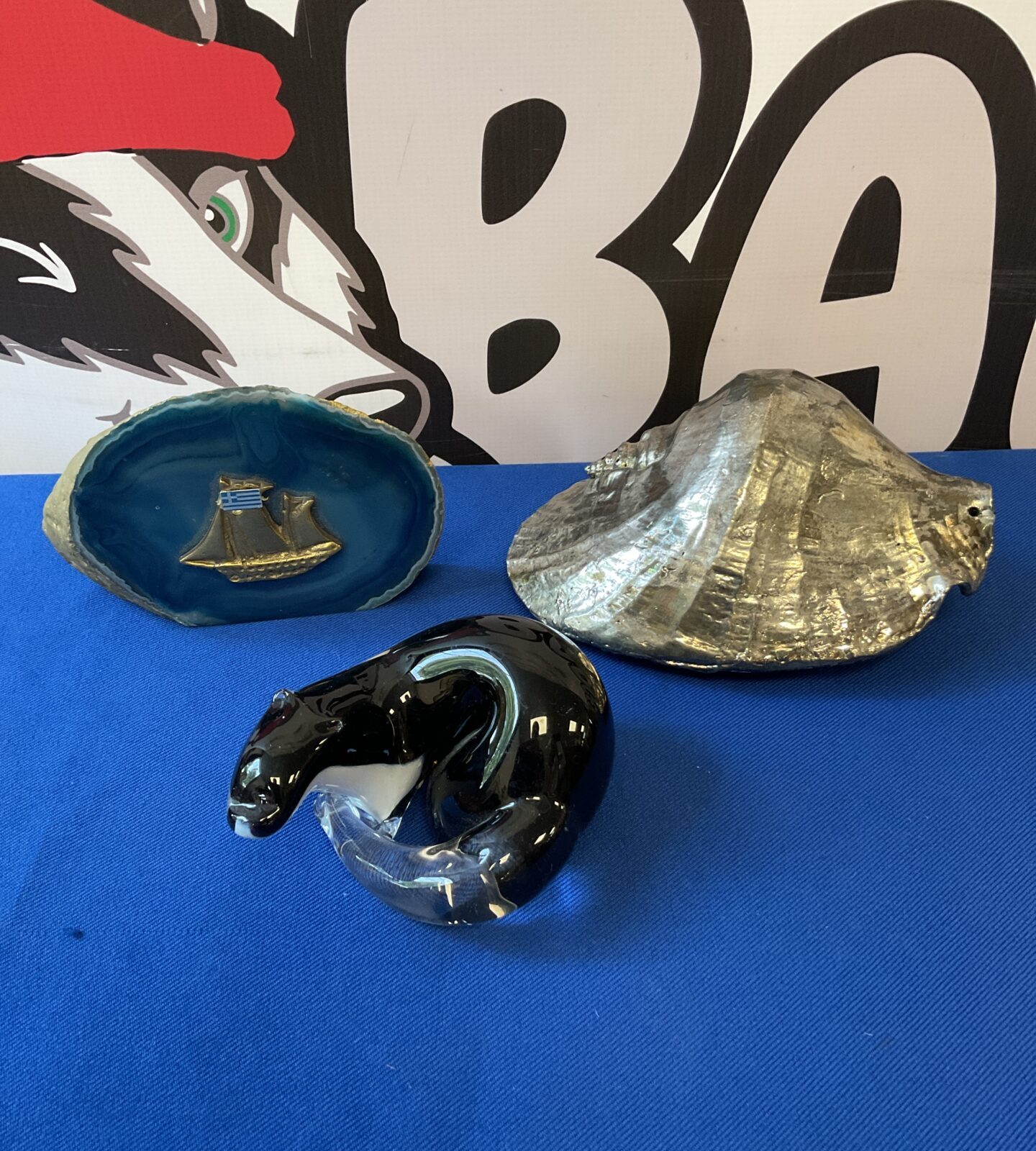Glass otter paperweight, silver dipped conch shell & greek ship paperweight