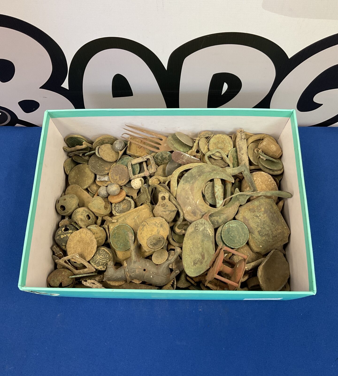 Collection of metal detector finds including coins & bells