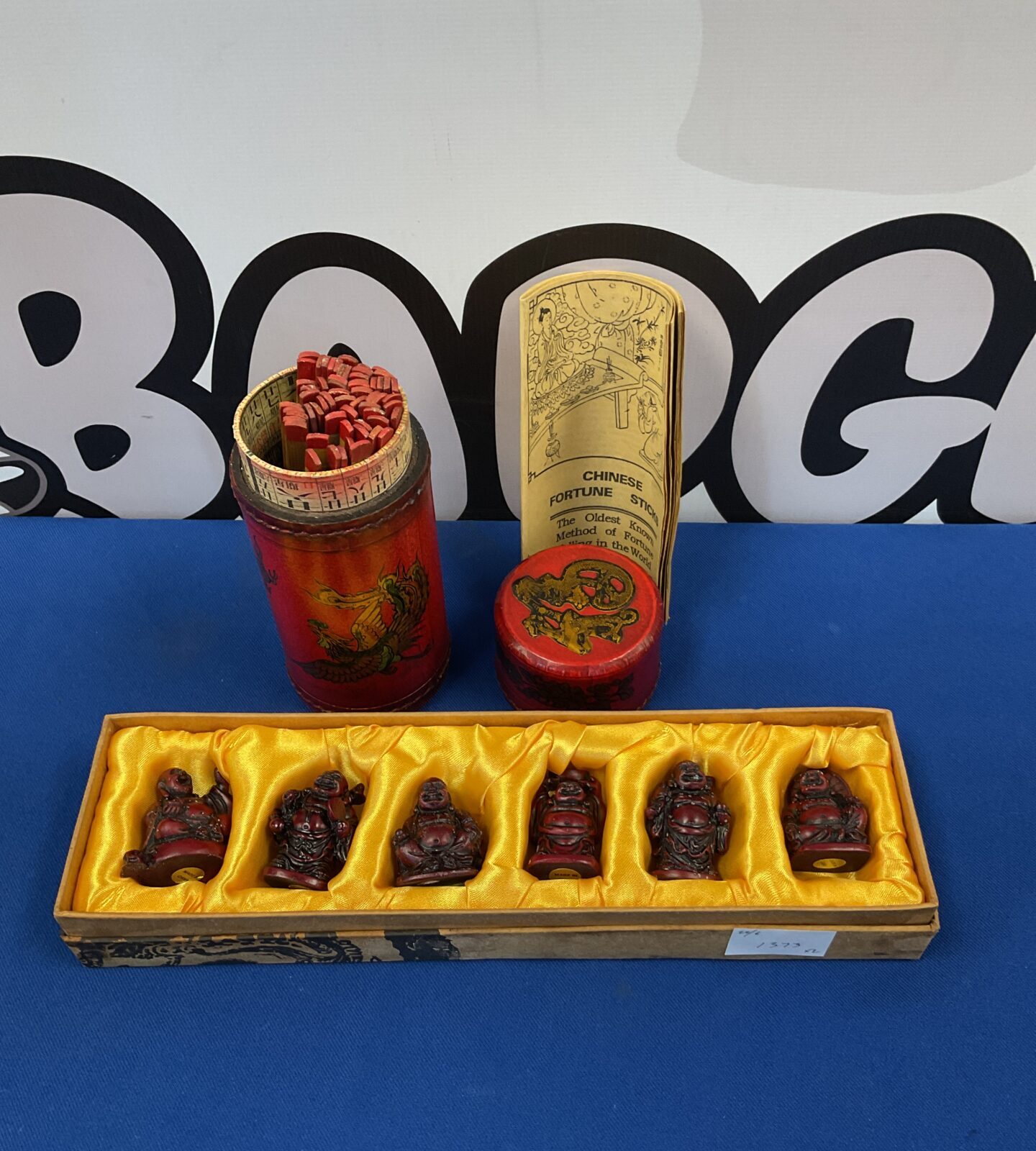Set of six miniature Buddhas & chinese fortune sticks