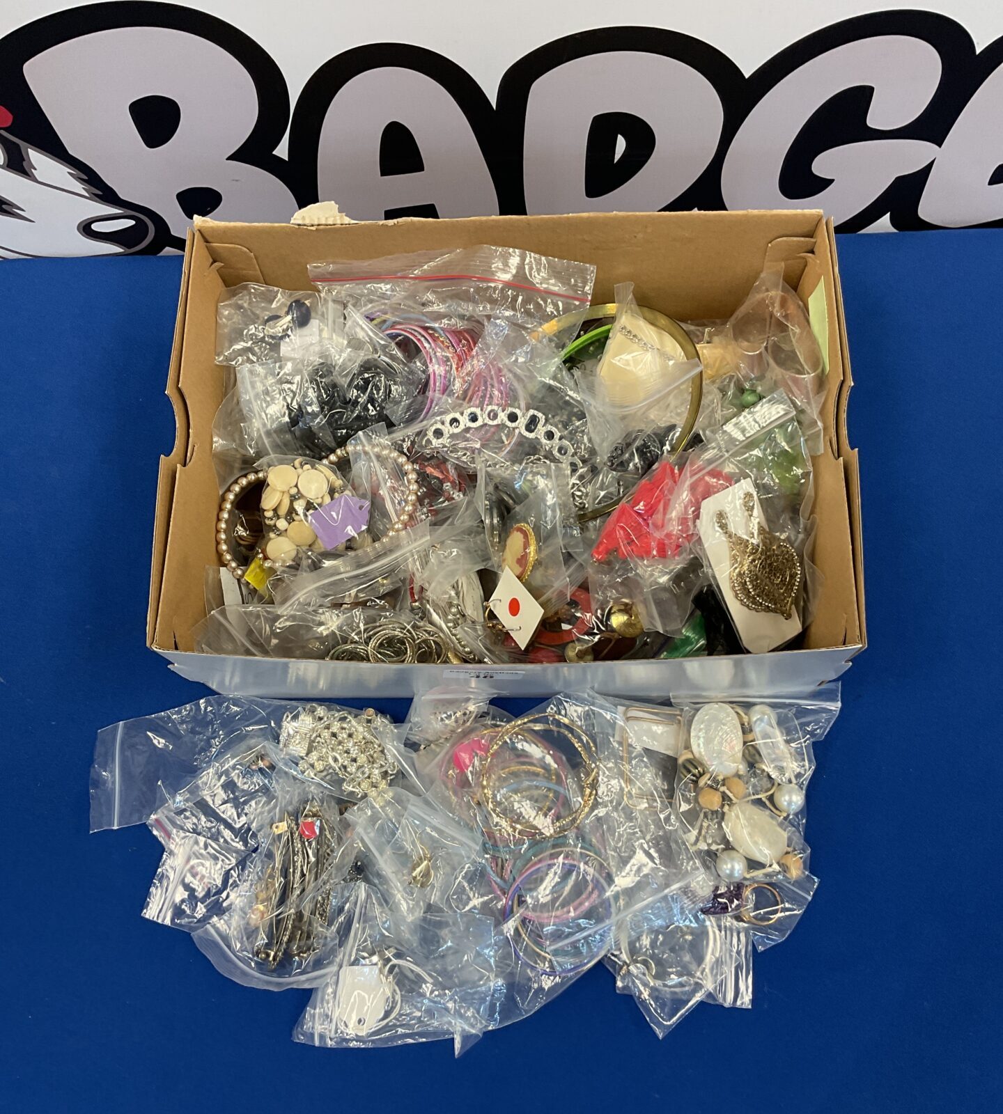 Box of costume jewellery including rings, bracelets & necklaces