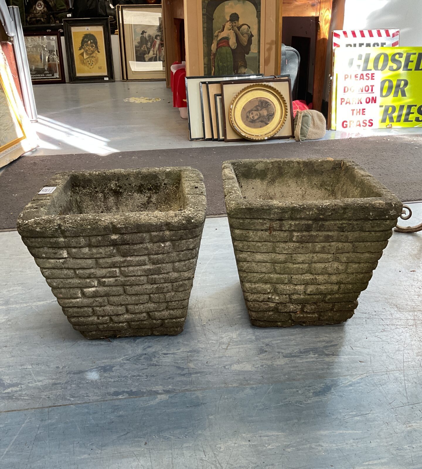 Pair of concrete brick pattern planters