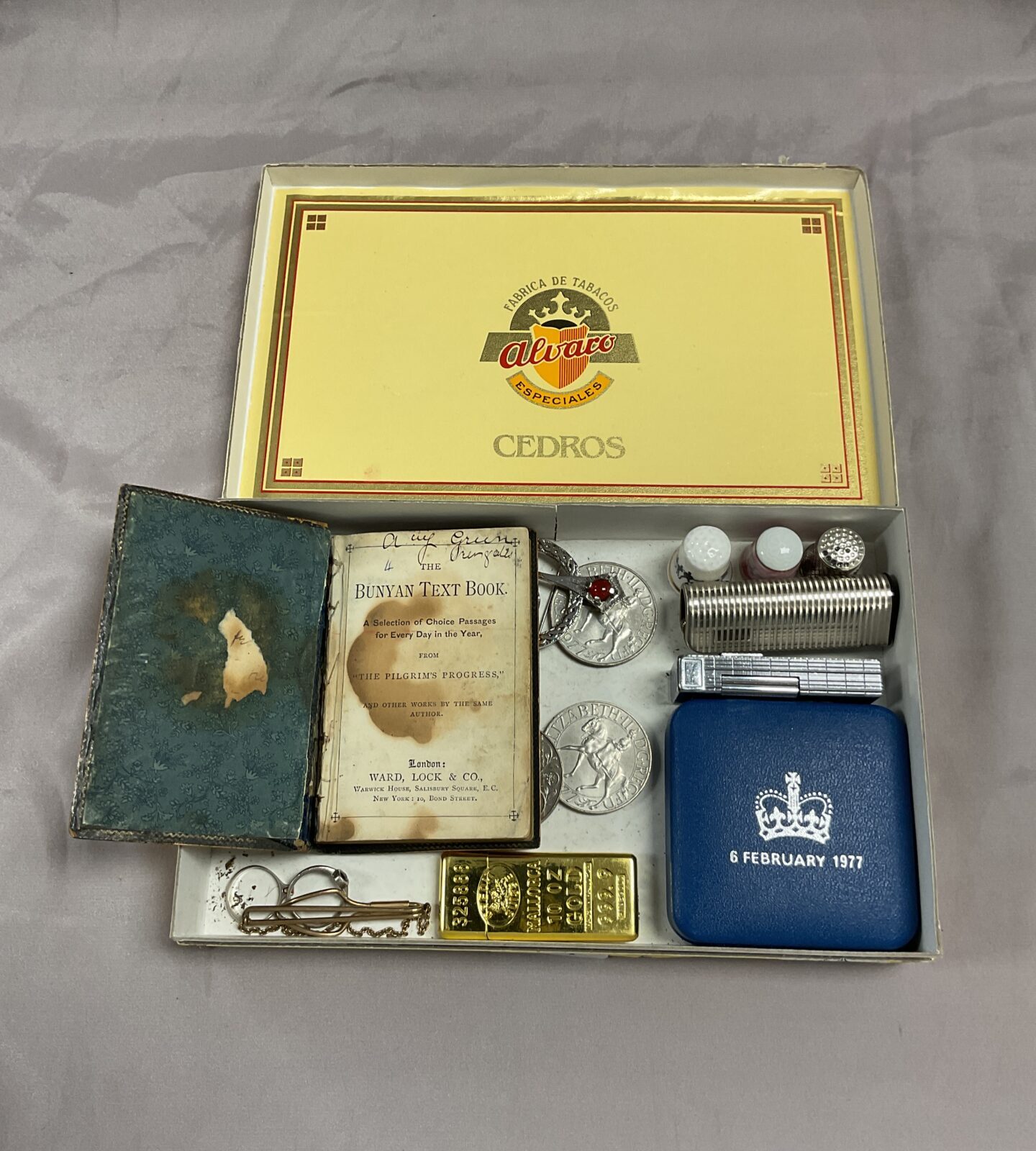 Cigar box of odds Inc lighters thimbles and Bunyan text book