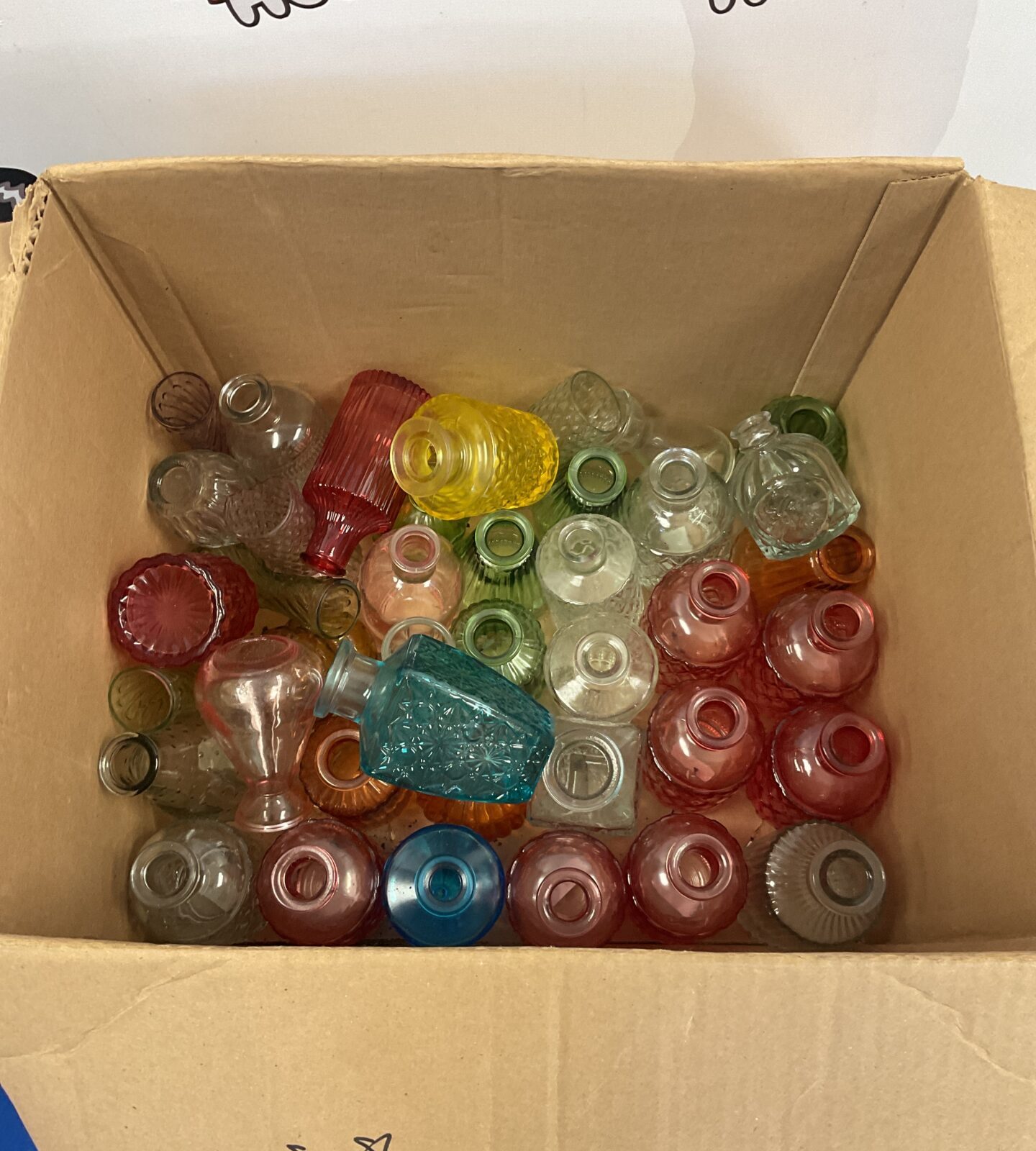 Box of coloured glass bottles & vases