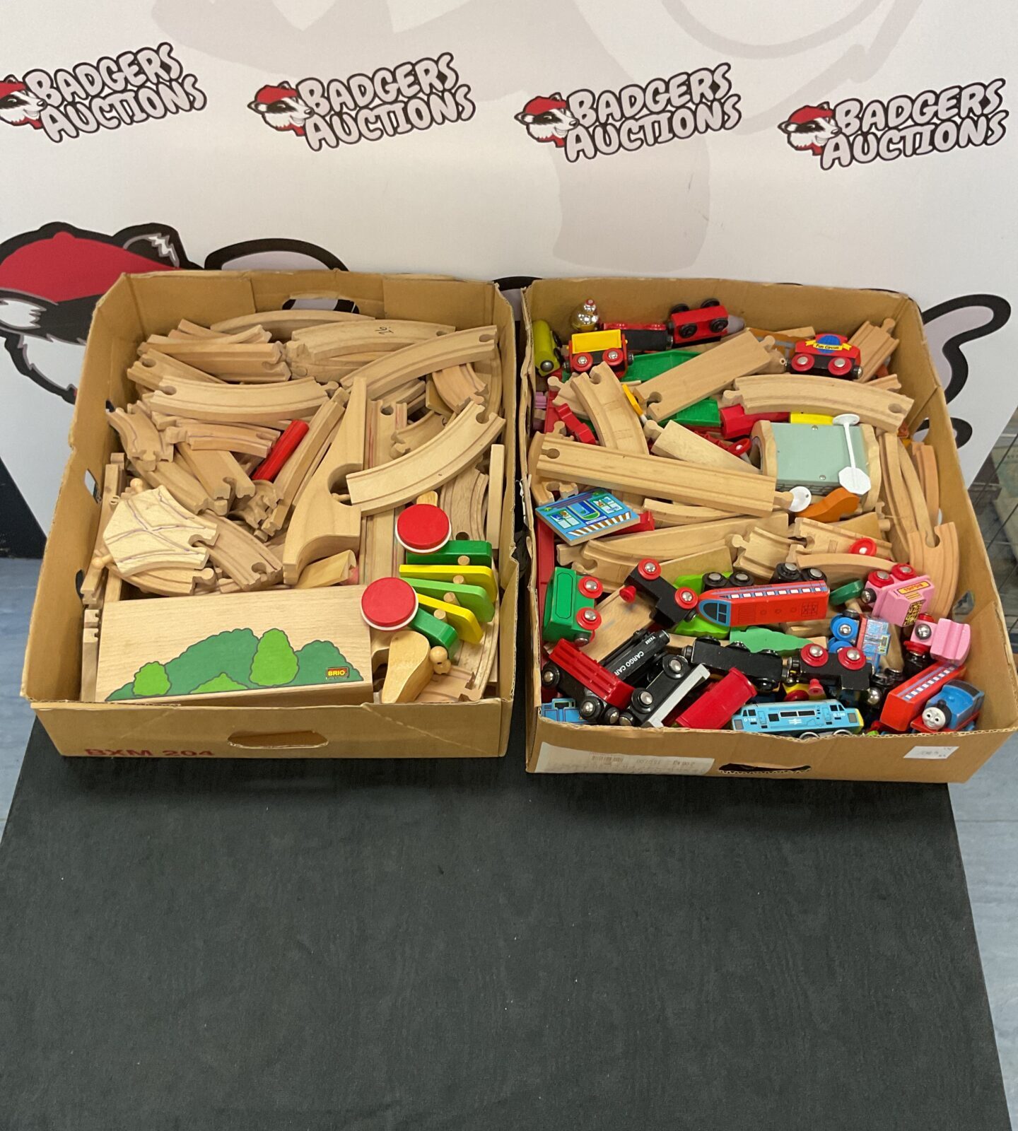 Two boxes of wooden train sets inc brio
