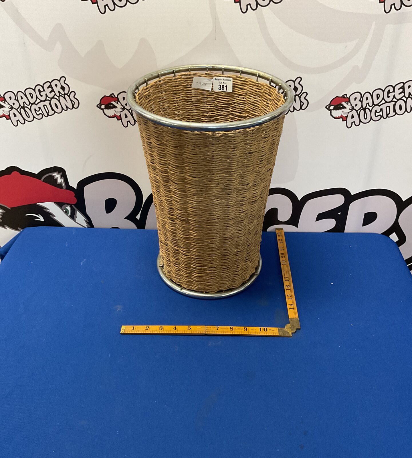 Wicker and chrome stick stand