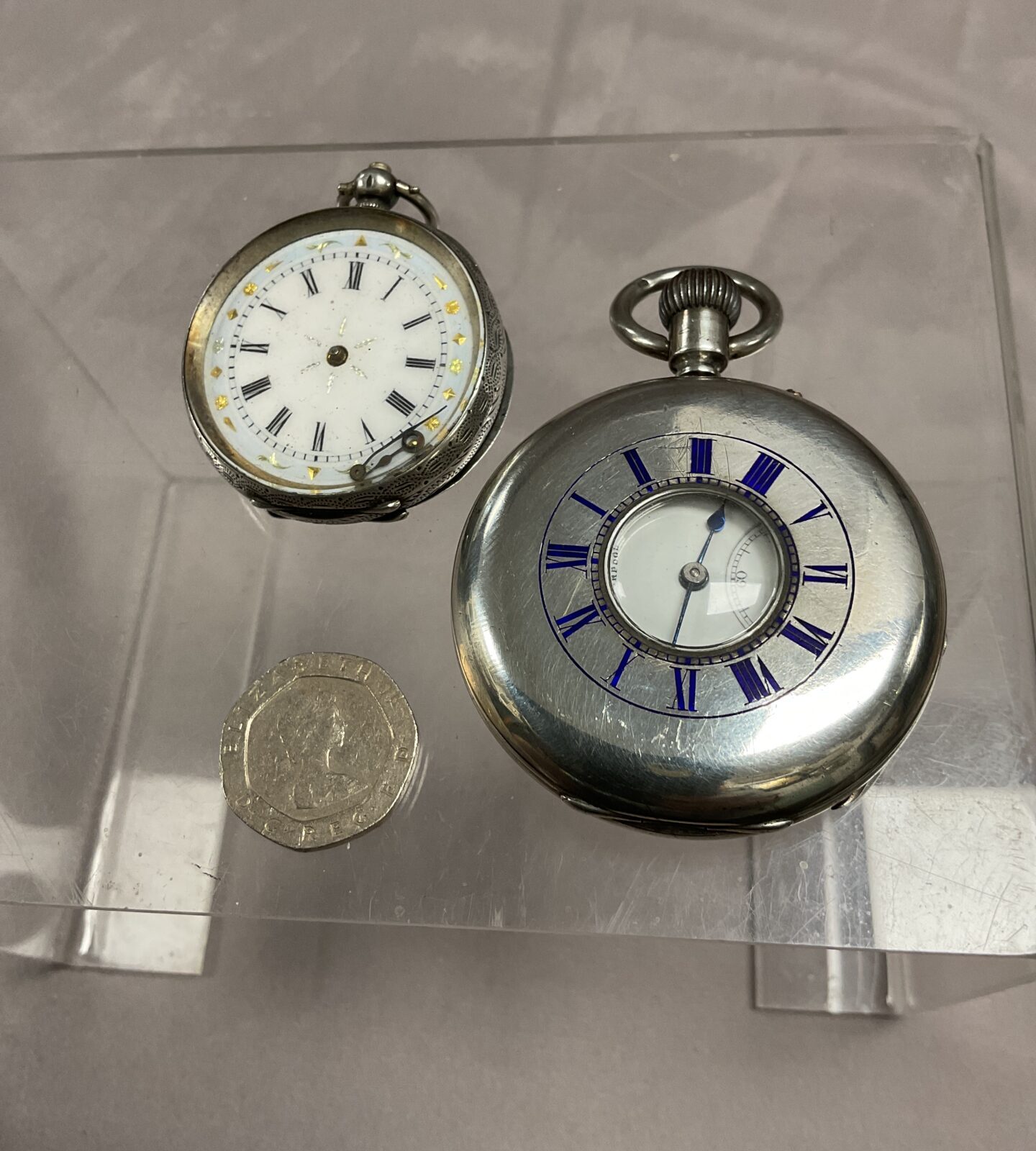Two silver pocket watches a half hunter by russels Ltd Liverpool and ladies silver pocket watch