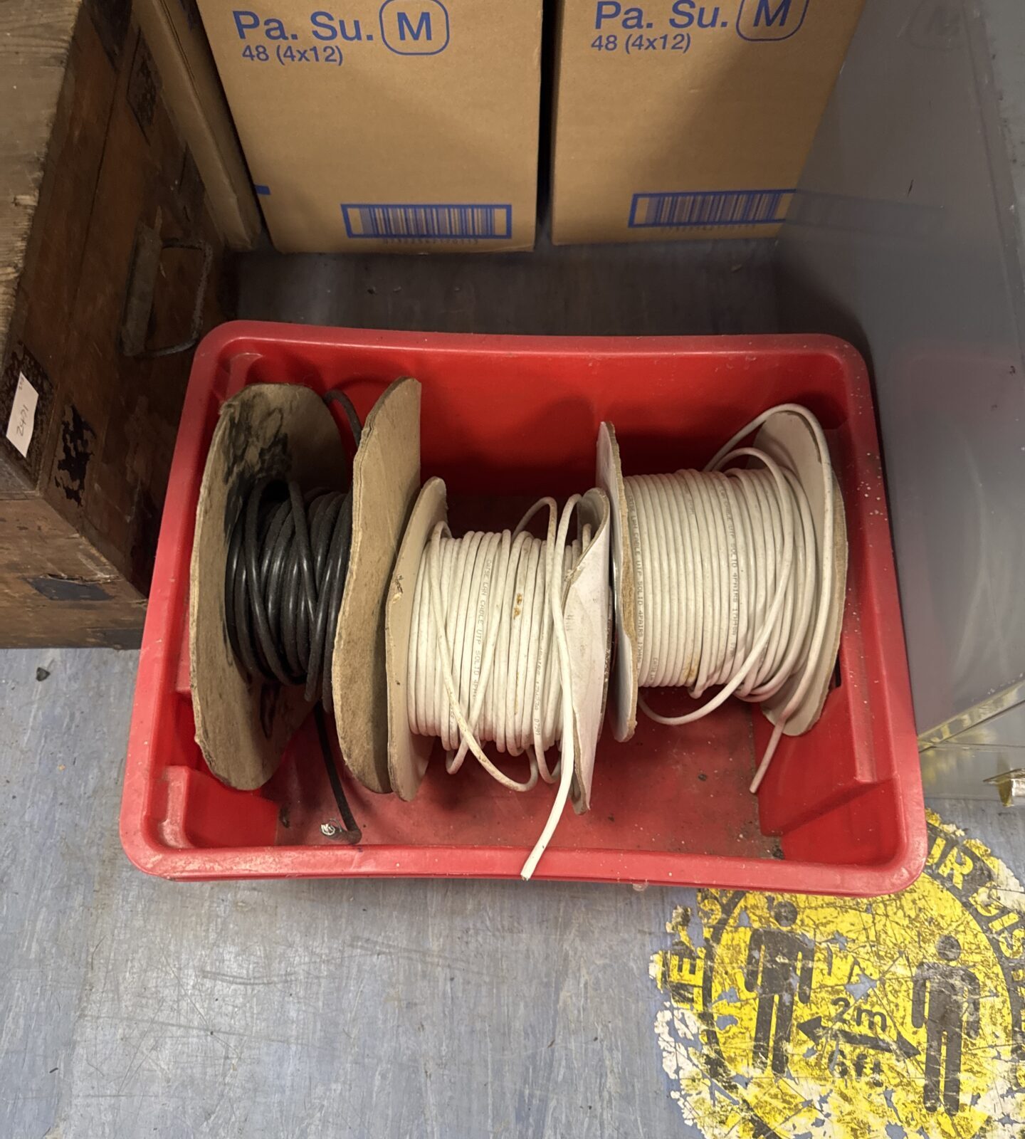 Three part used rolls of networking cable