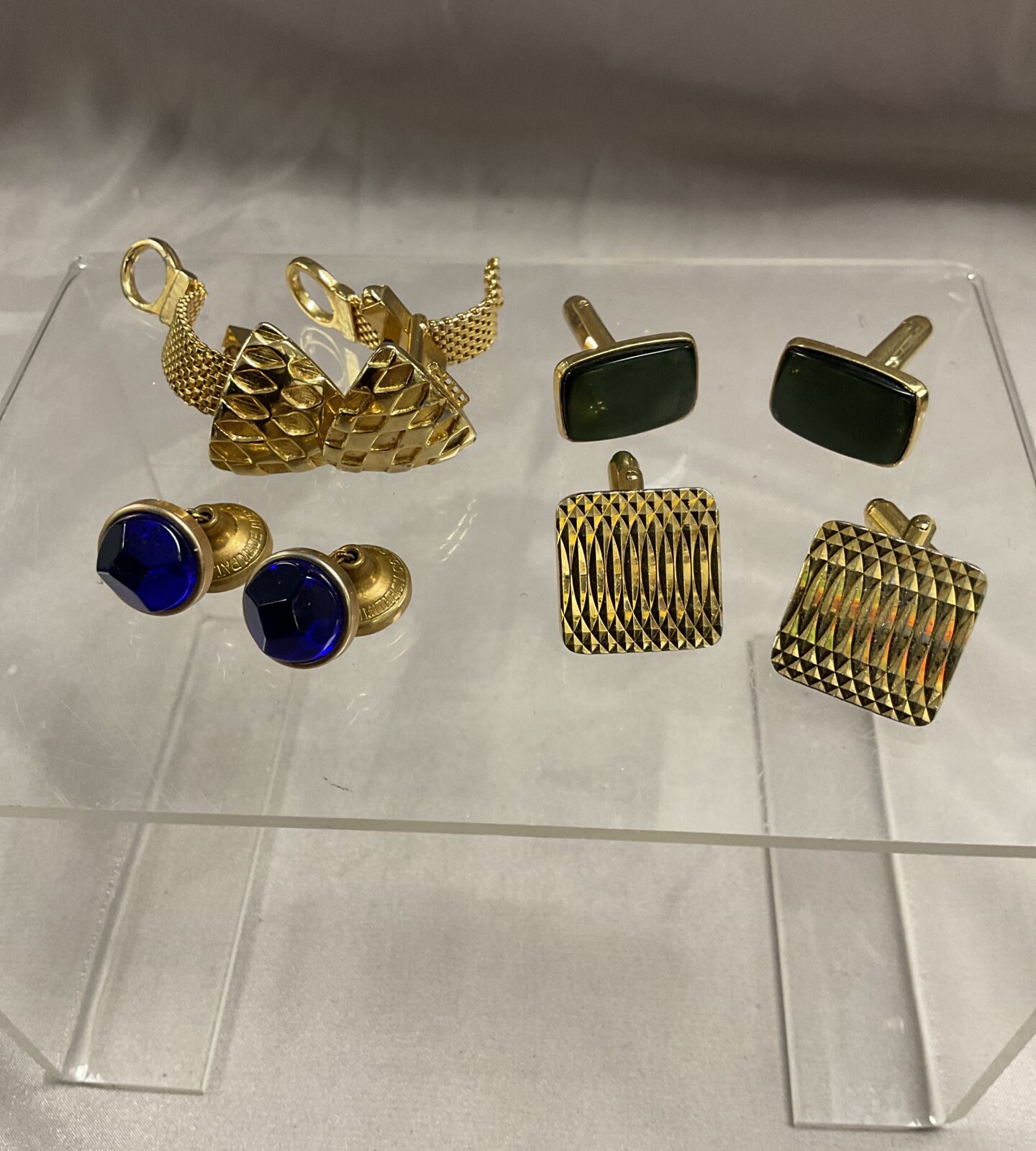 Four pairs of cufflinks One pair needs attention