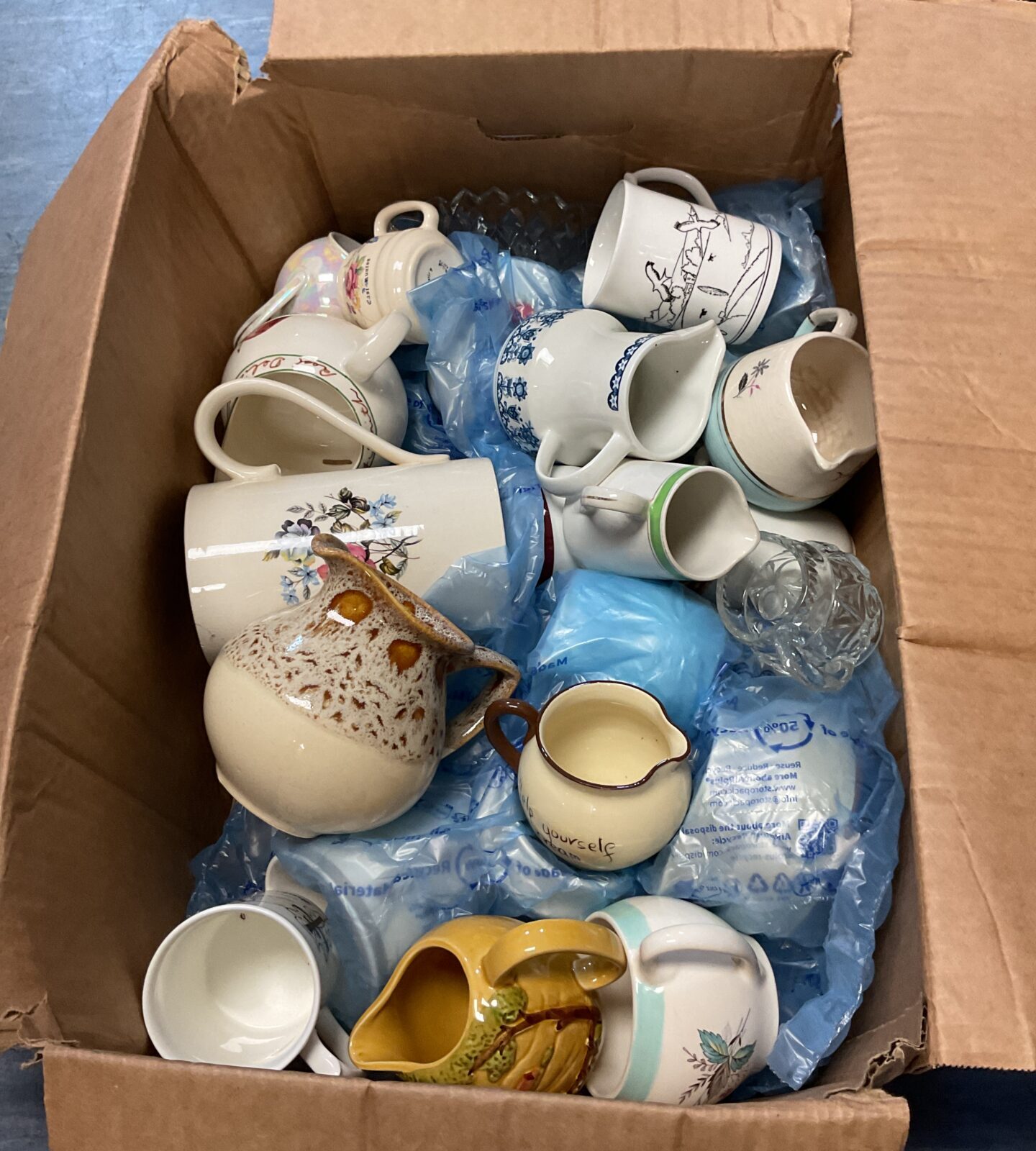 Box of mixed pottery and china mugs inc fosters and johnsons