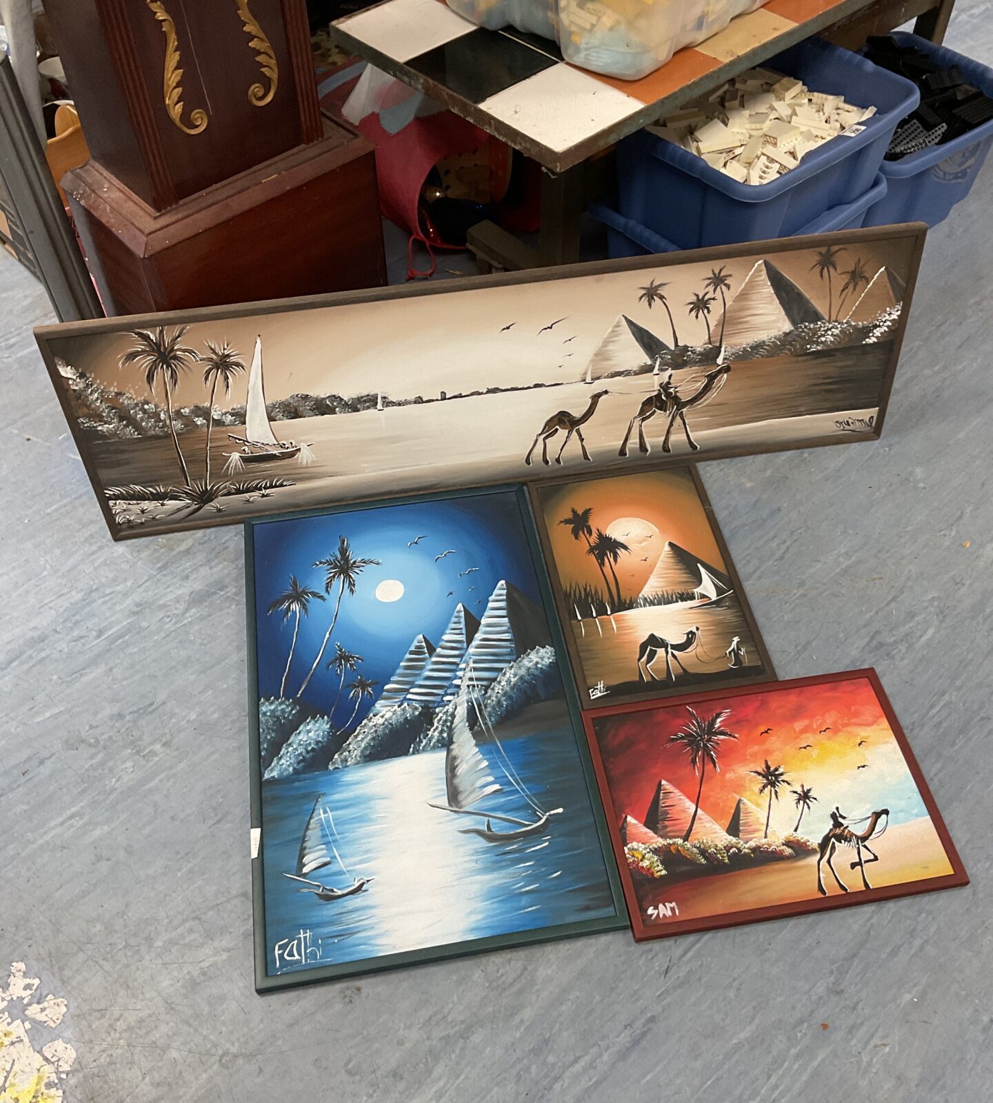 Four original Egyptian oil on board paintings of the great pyramids