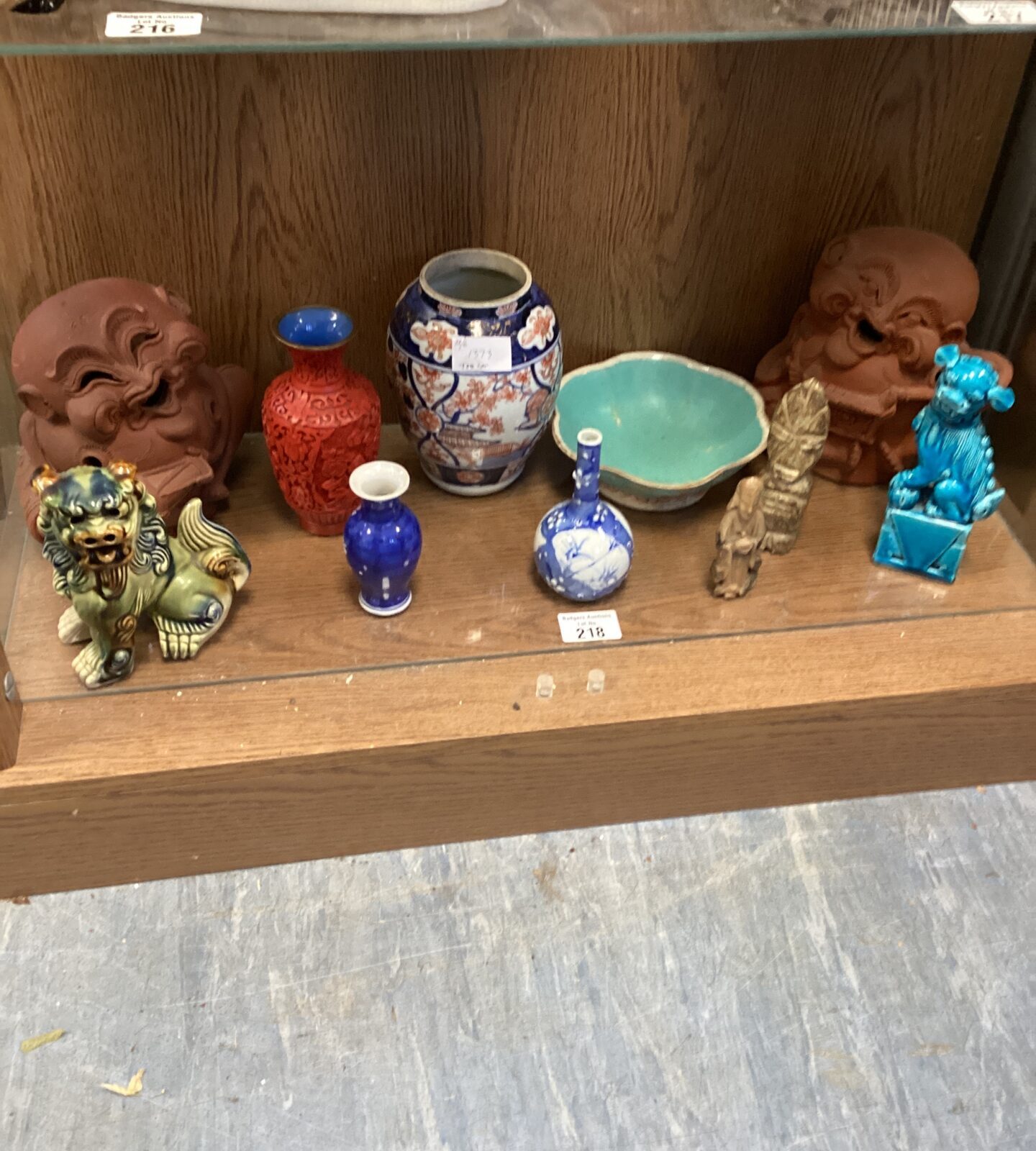 Collection of oriental items, including dogs of foo
