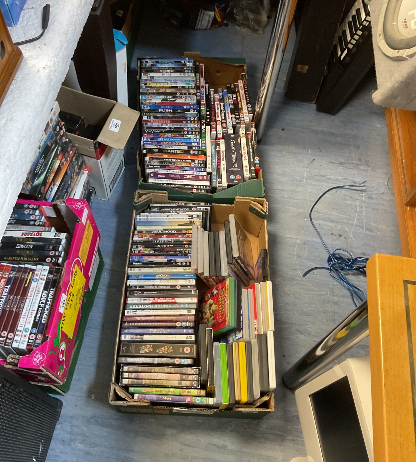 Two trays of mixed dvds