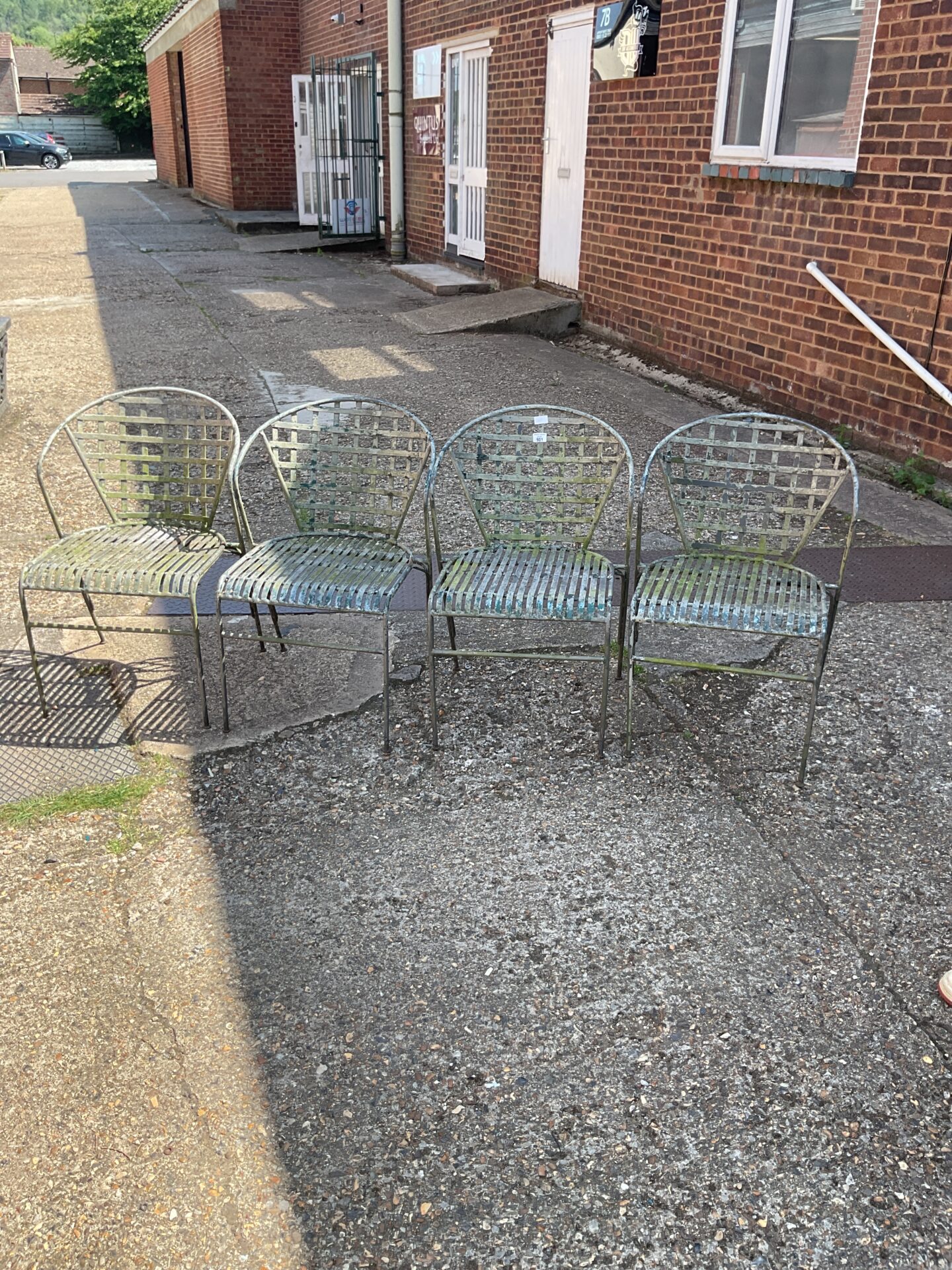 Four rought iron garden chairs