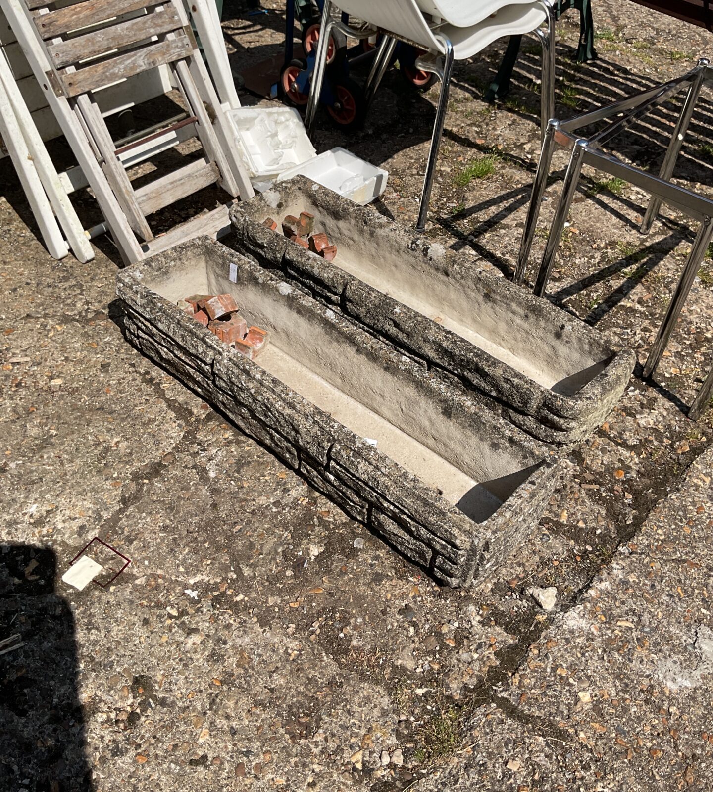 Two concrete garden planters
