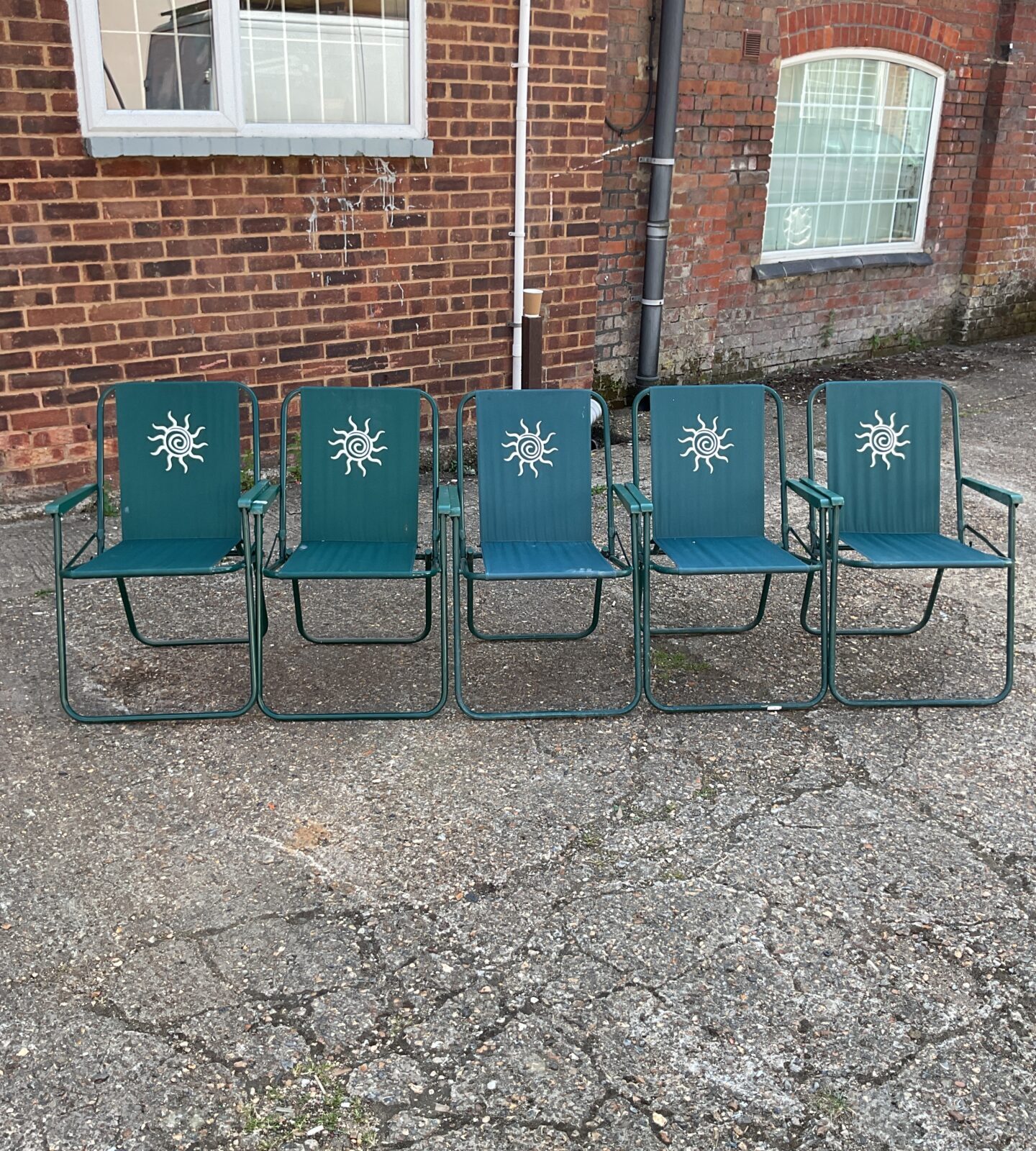 Five green garden sun chairs