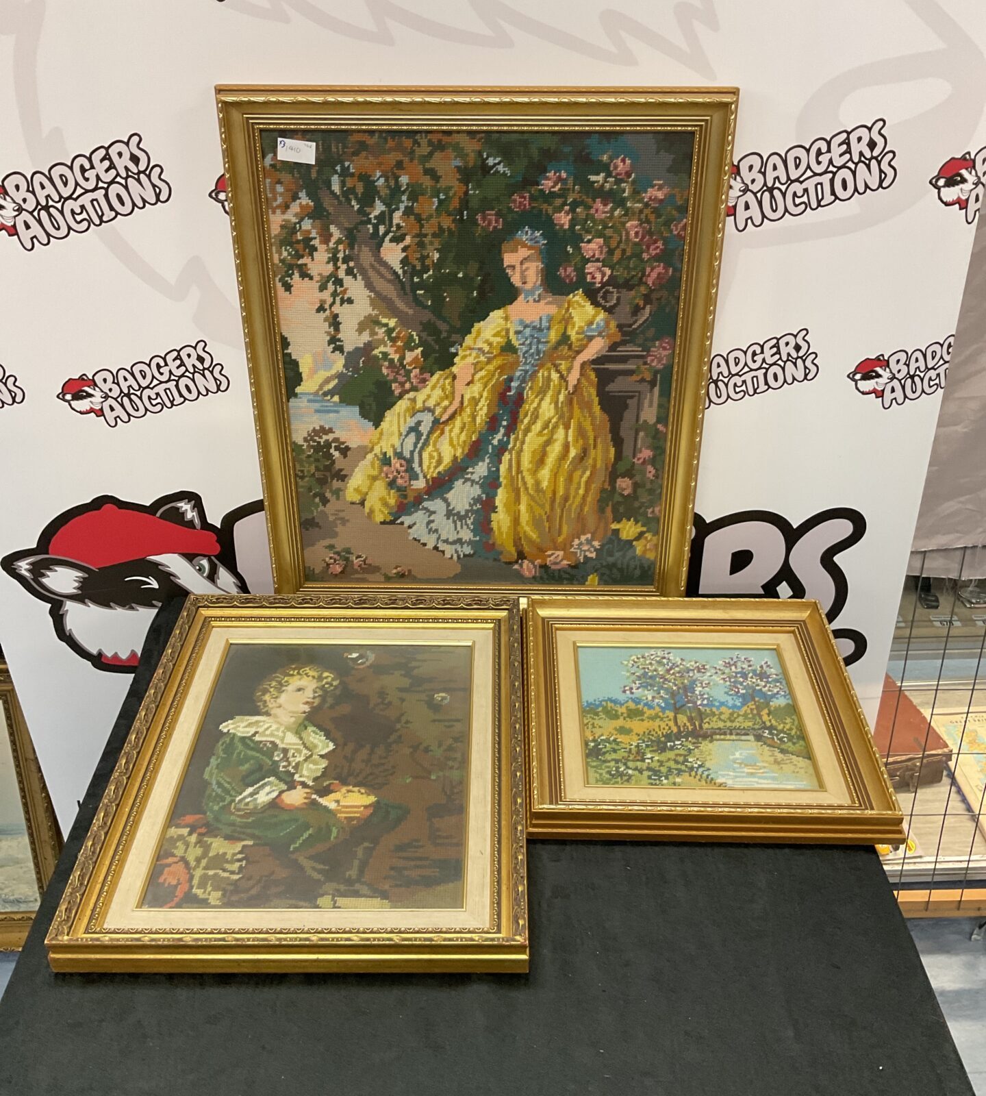 Three gilt framed embroideries including pears bubbles
