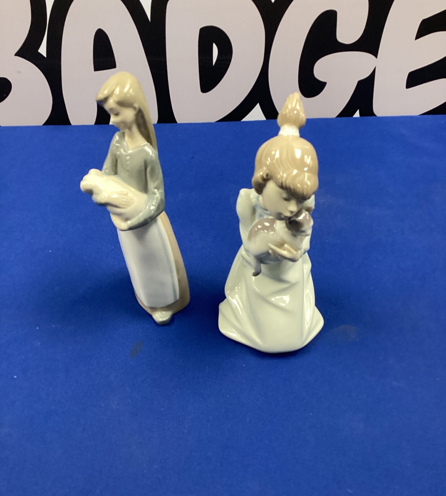 Two lladro porcelain figurines inc girl with cat & girl with pig