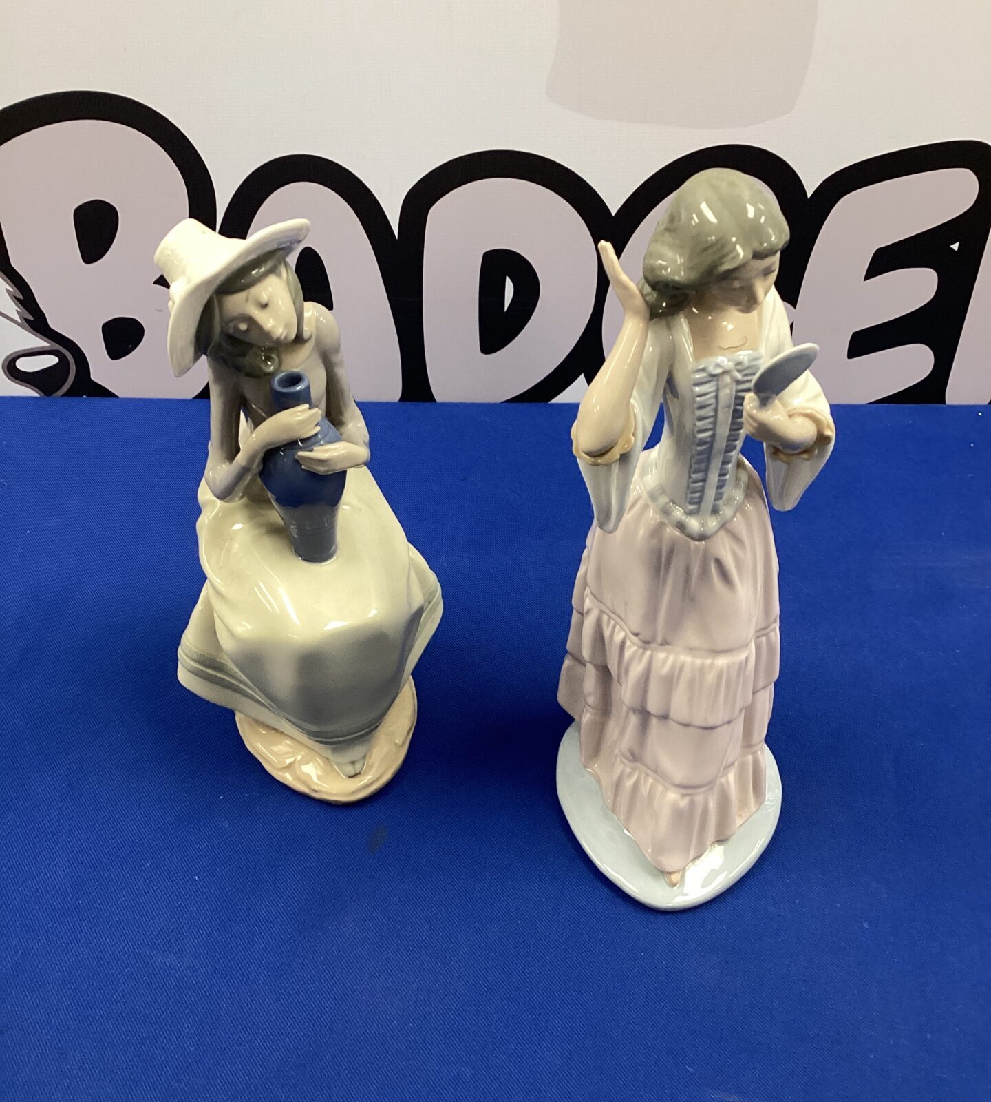 Two porcelain nao lladro figurines inc girl with vase & lady with vanity mirror