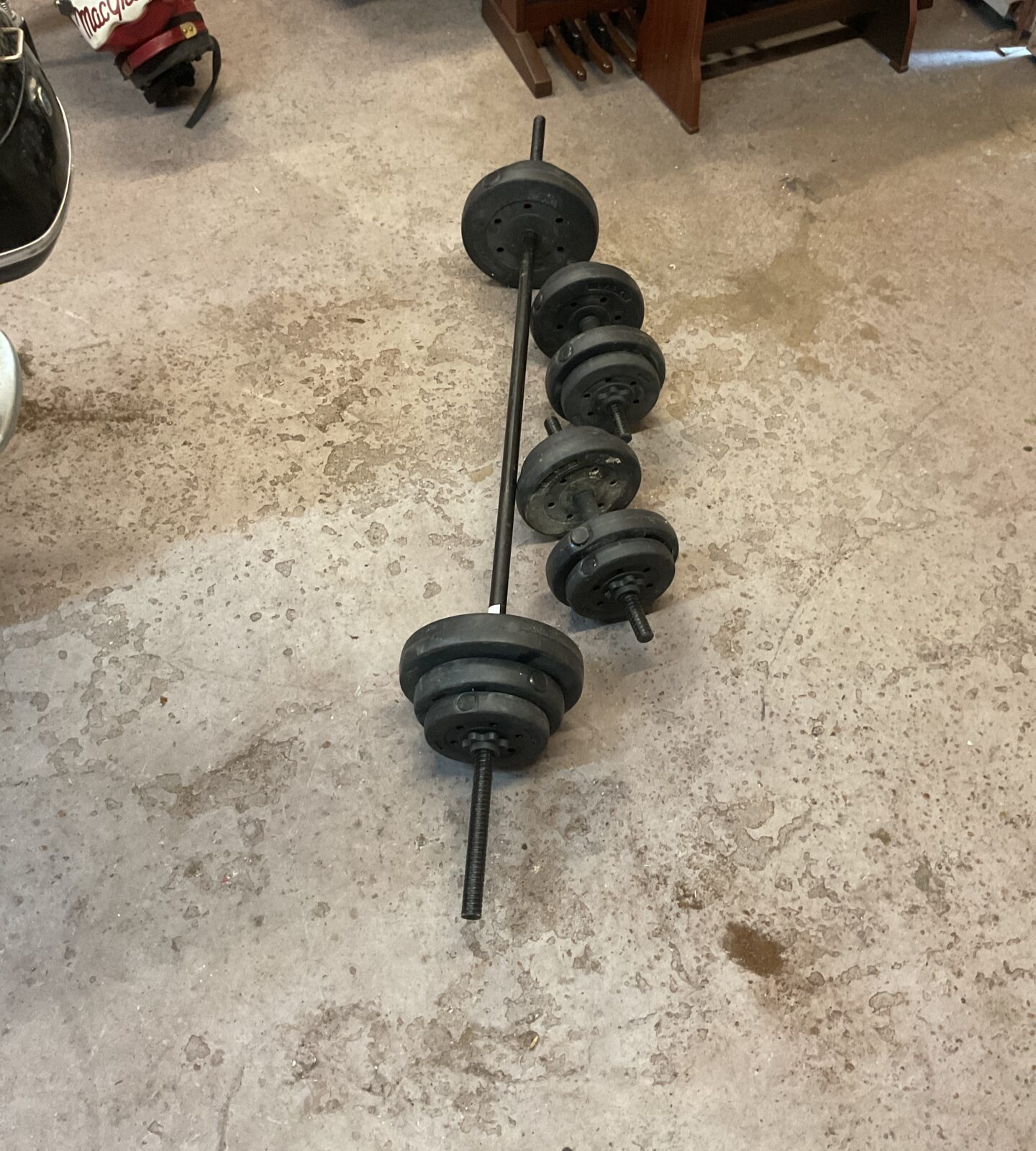 Black barbel with two dumbbells