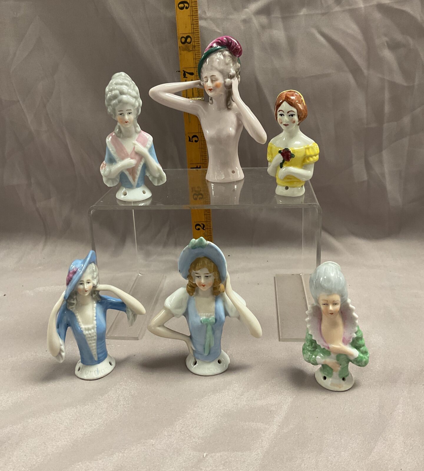Six vintage German porcelain pincushion half dolls