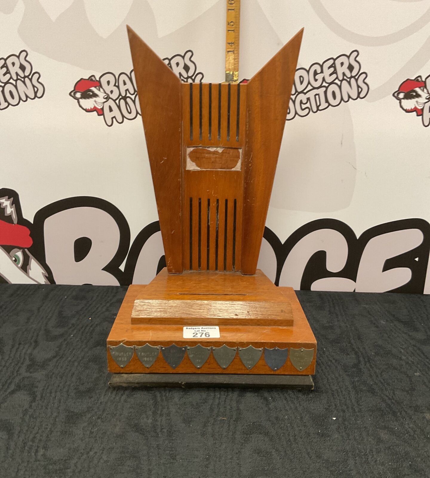 Art deco farm related trophy stand with shields aroun base