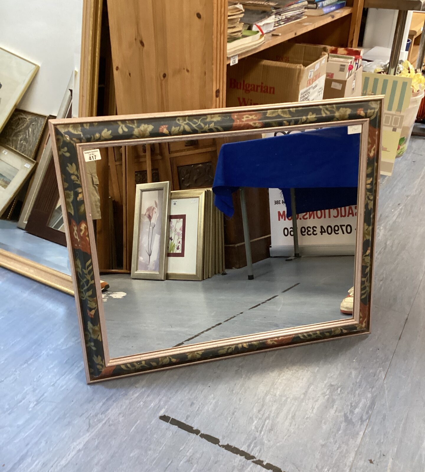 Large floral pattened framed mirror 35”L has cosmetic marks on framed