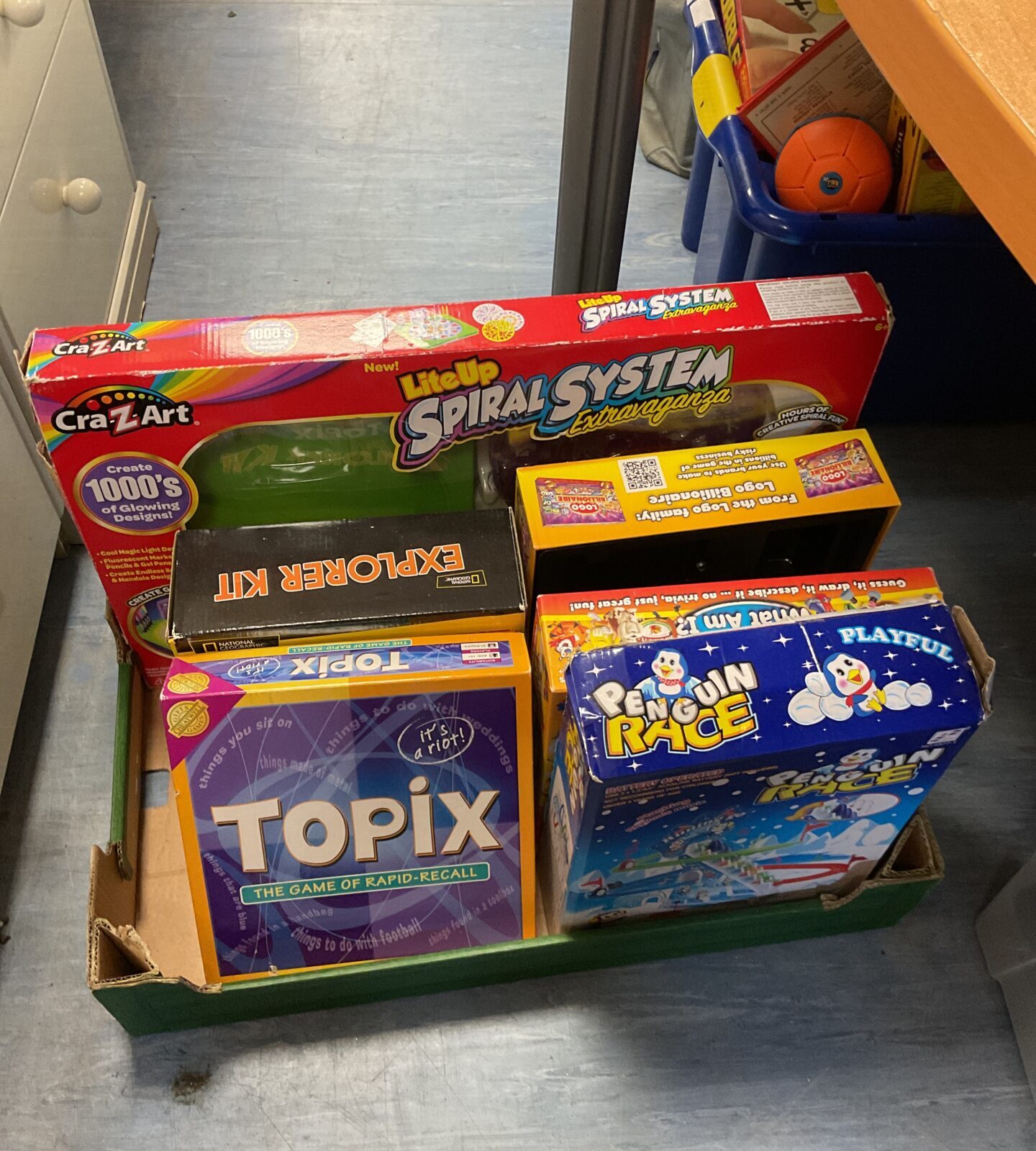 Box of childrens toys & games including crazart lite up spiral system