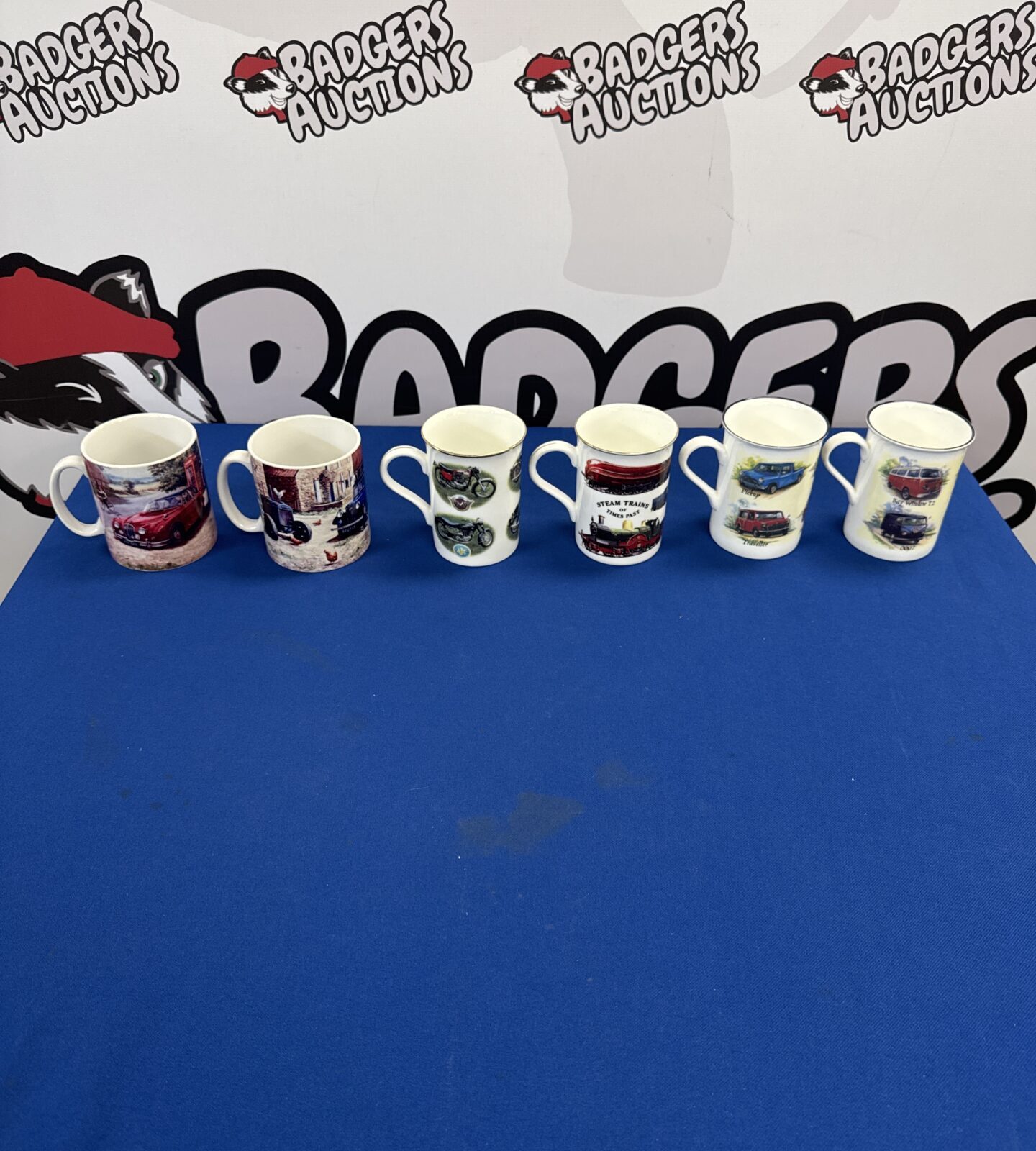Six assorted transport related cups inc Vw camper & mini