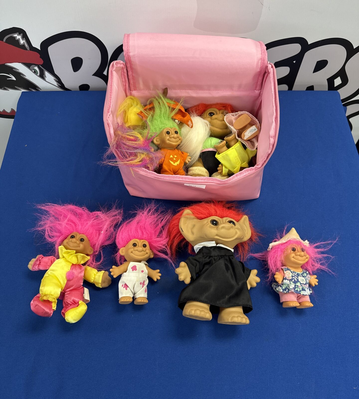Selection of retro trolls toys with a pink carry bag