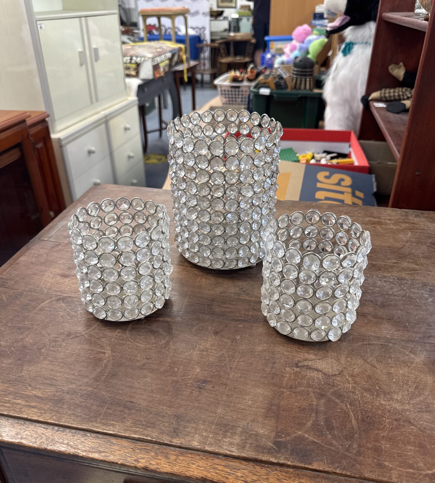 Three plastic jewel effect candle holders