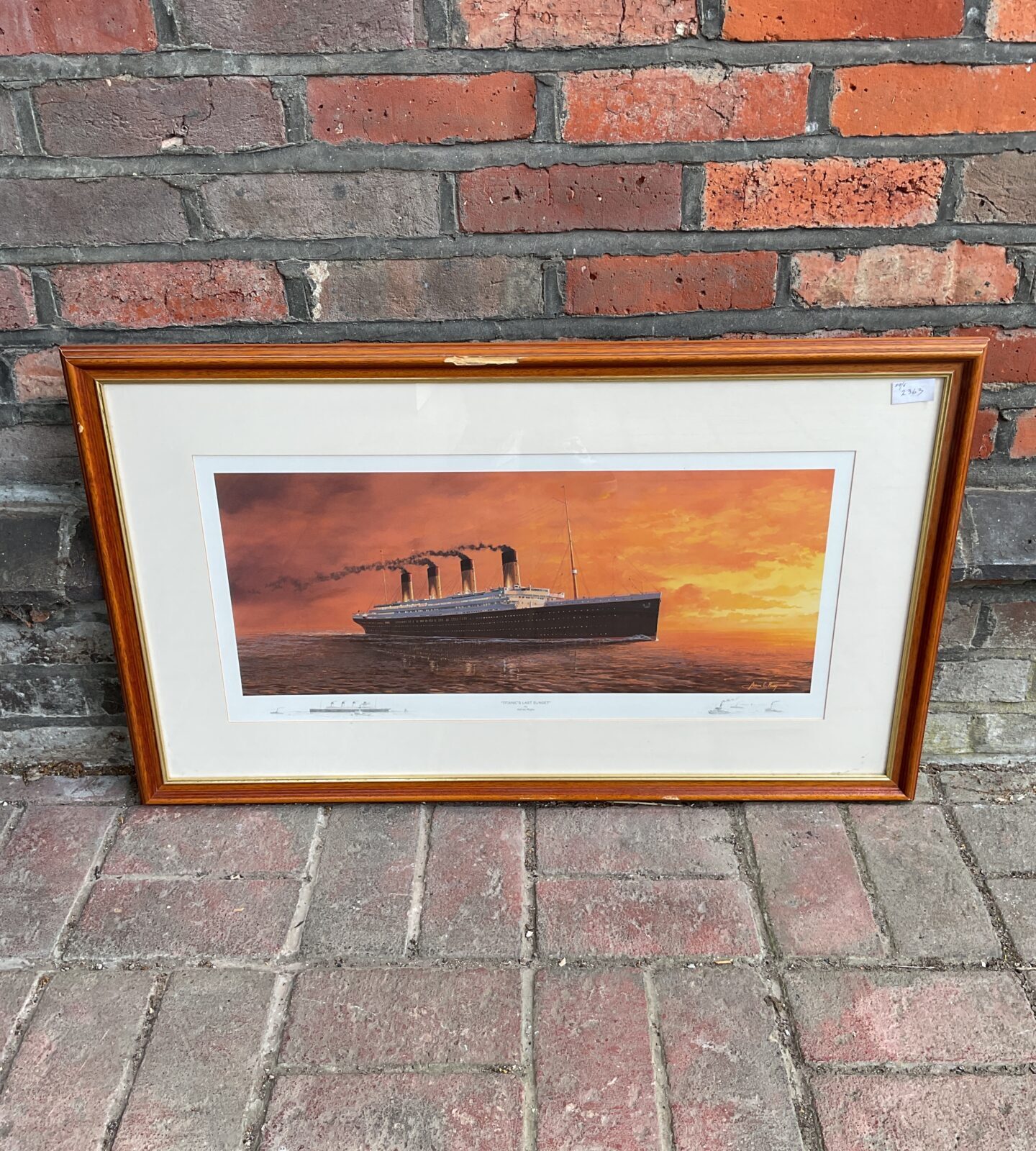 Art print titled titanic’s last sunset by Adrian Rigby - frame has damage