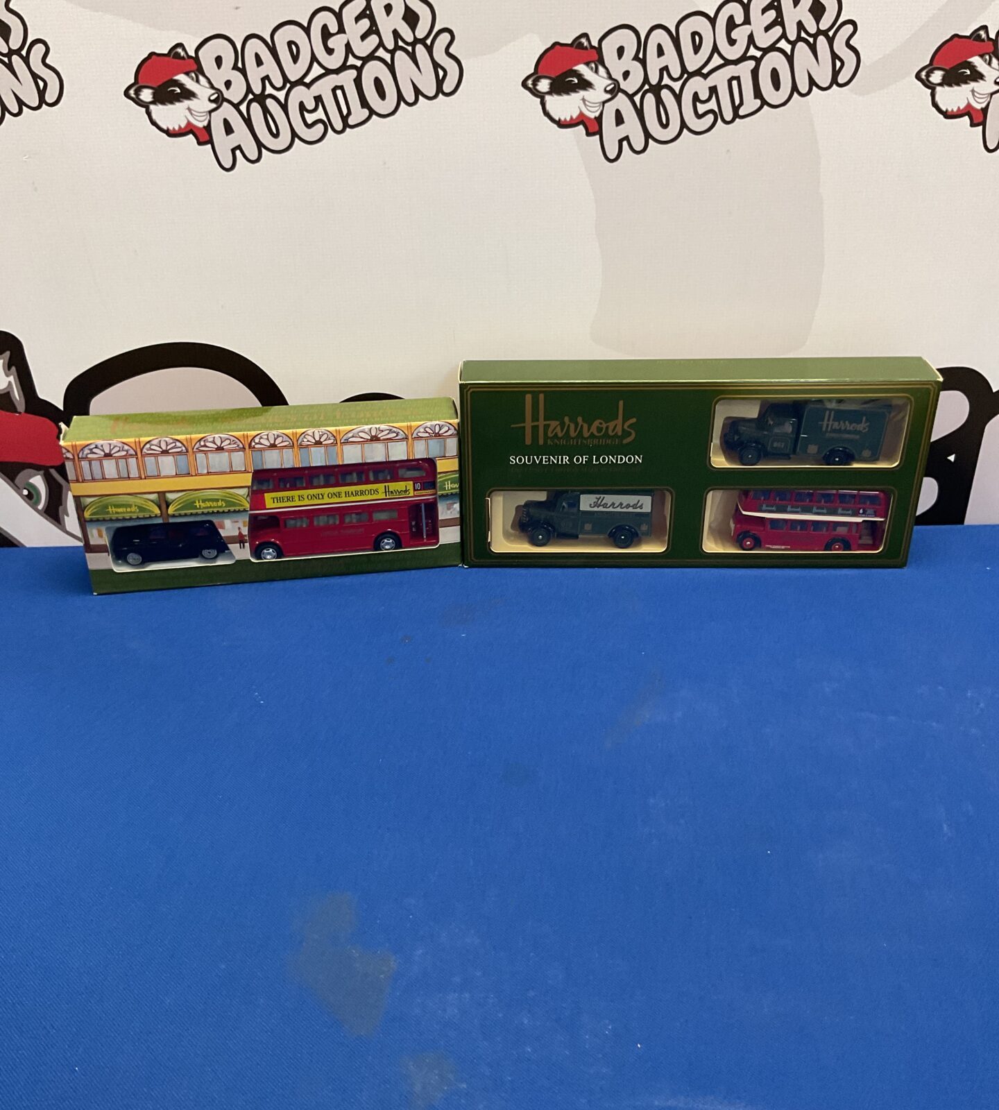 Two boxed Harrods scenes of london diecast models