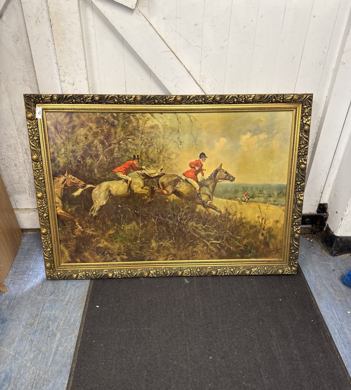 Large gilt framed print on board of steeplechasing - frame slightly warped