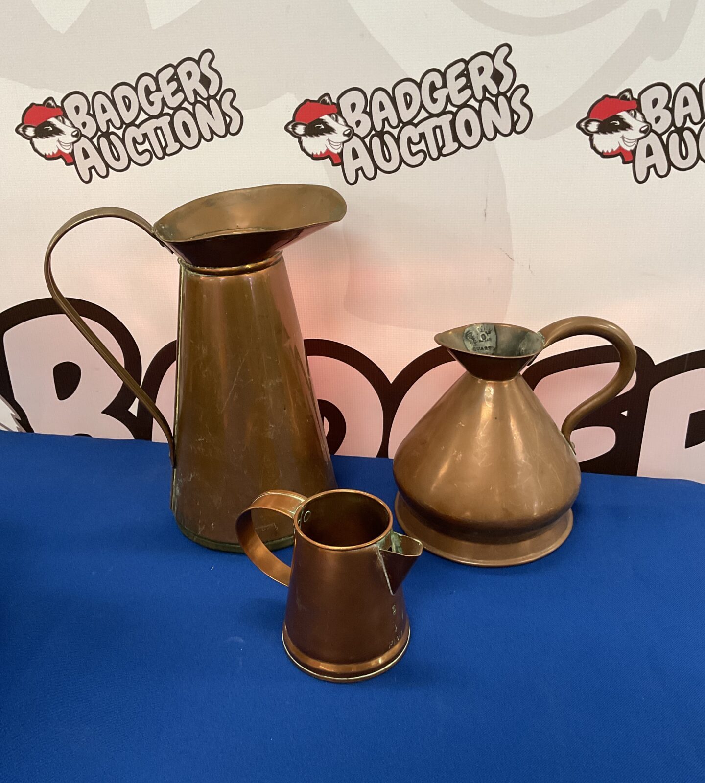 Three vintage copper jugs