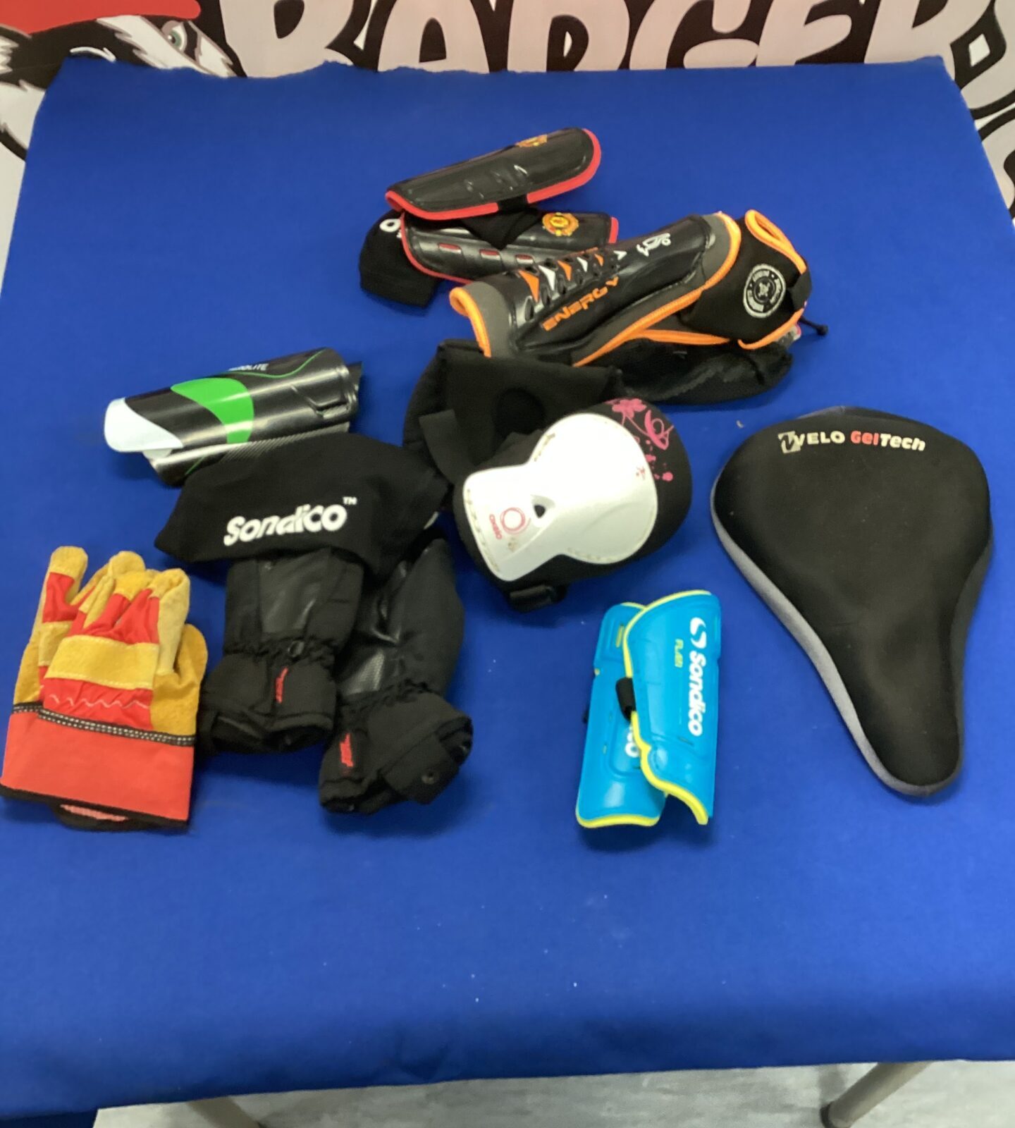 Bag of kids shin pads f gloves & gel cycle saddle