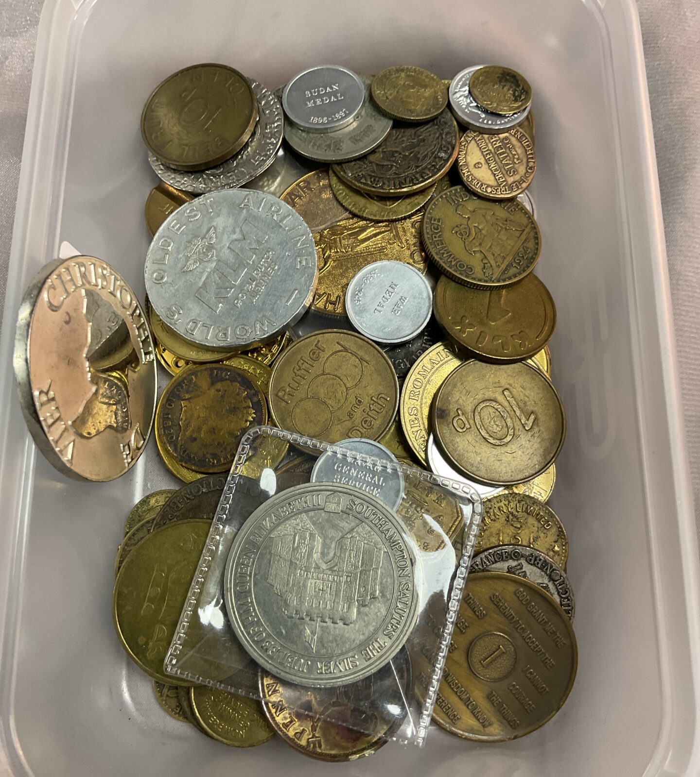 Tub of assorted coins