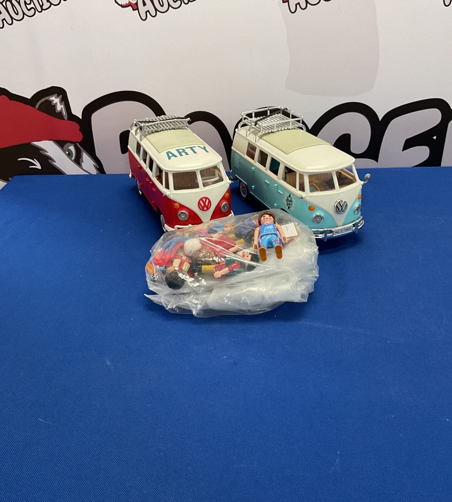 Two vw playmobile campervans and selection of playmobile figures
