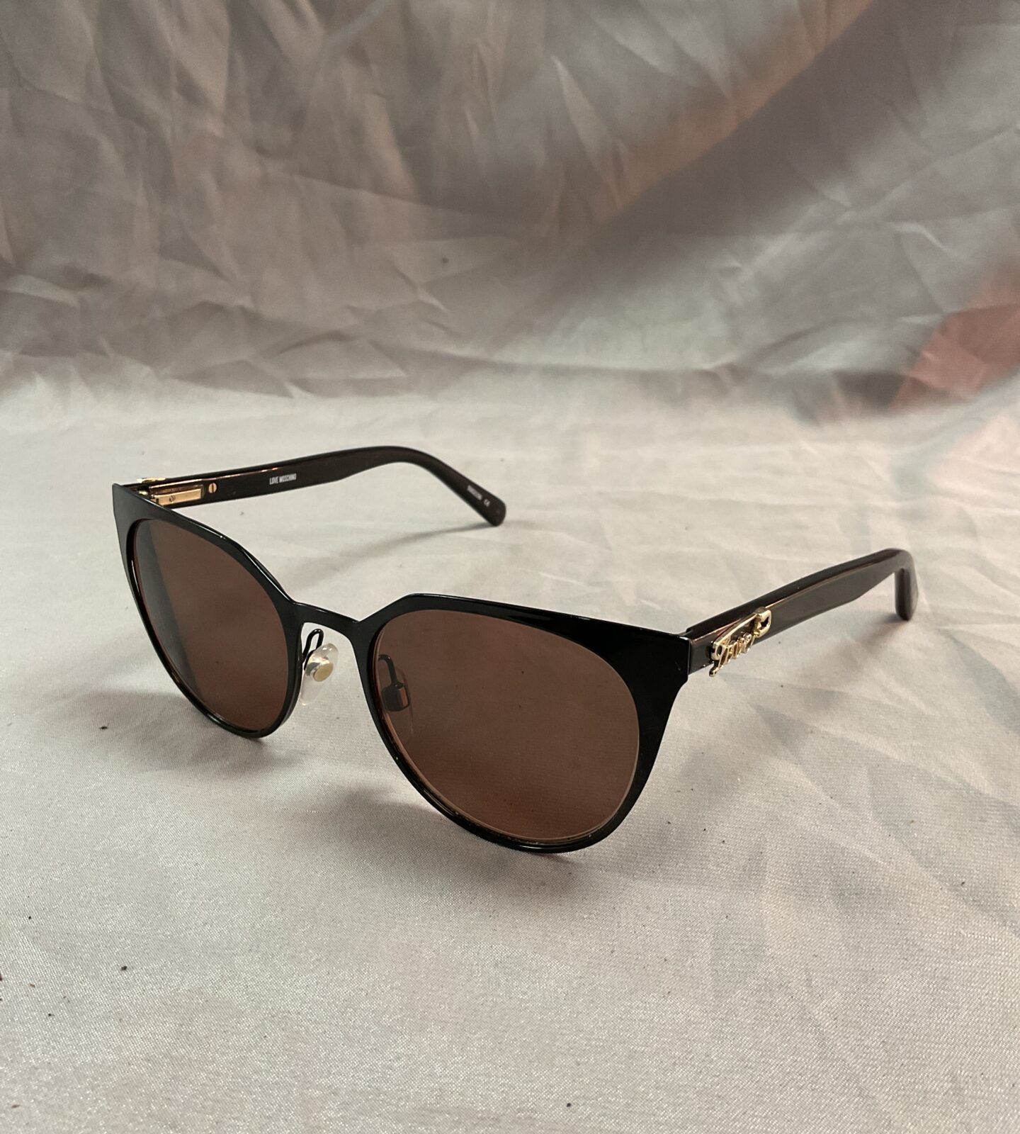 Pair of moschino love sunglasses