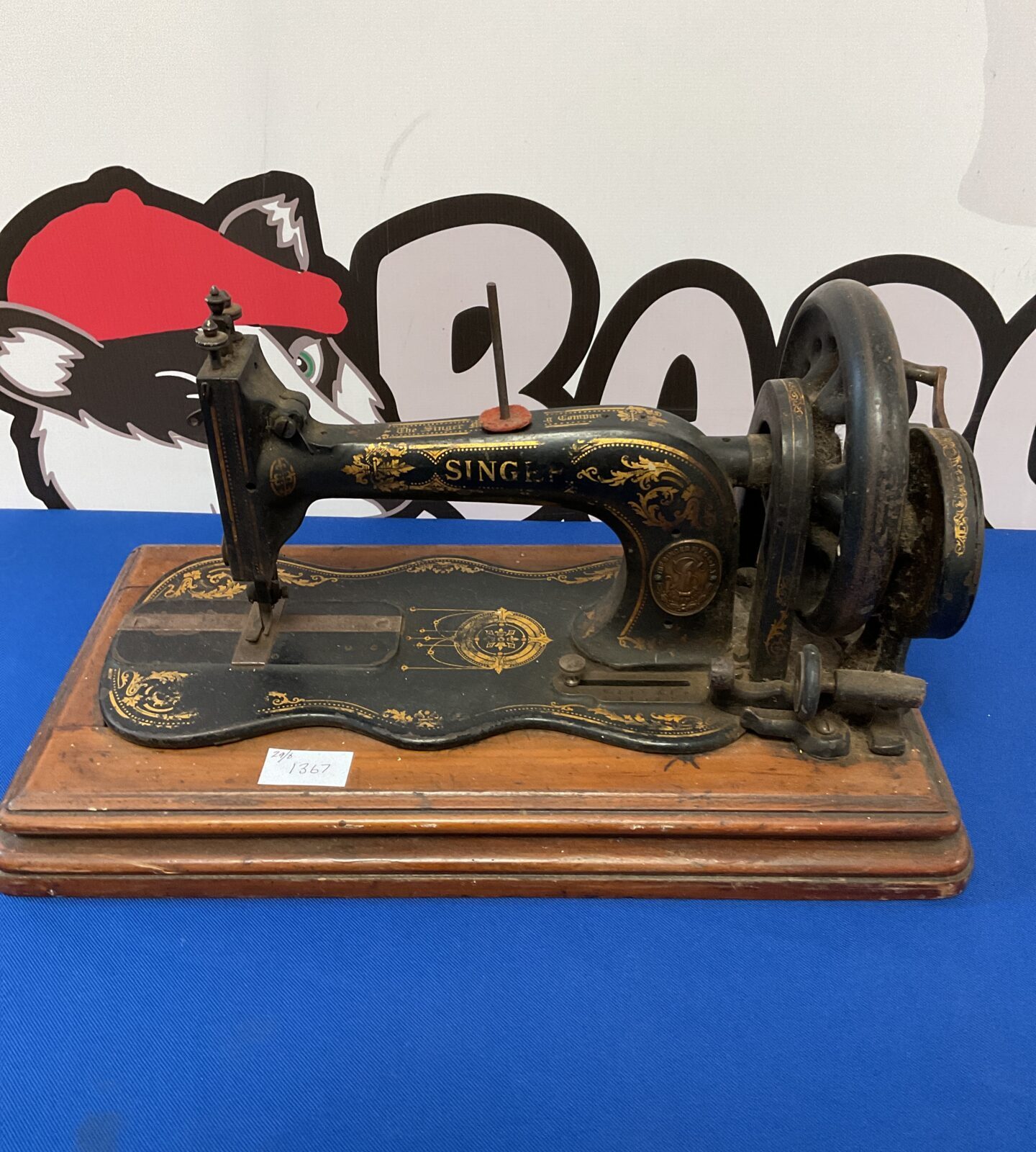 Antique hand cranked singer sewing machine