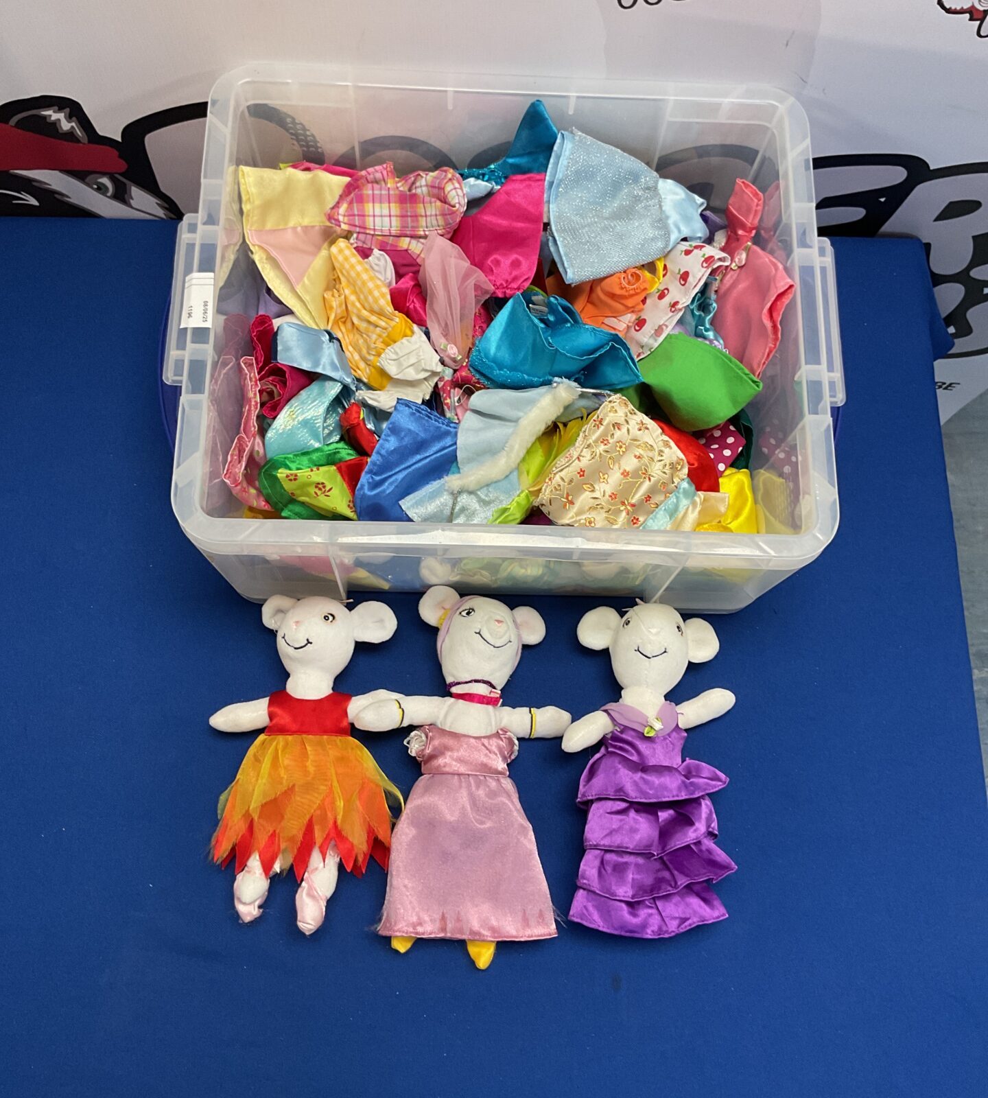 Three Angelina Balerina soft toys with assortment of clothing on accessories