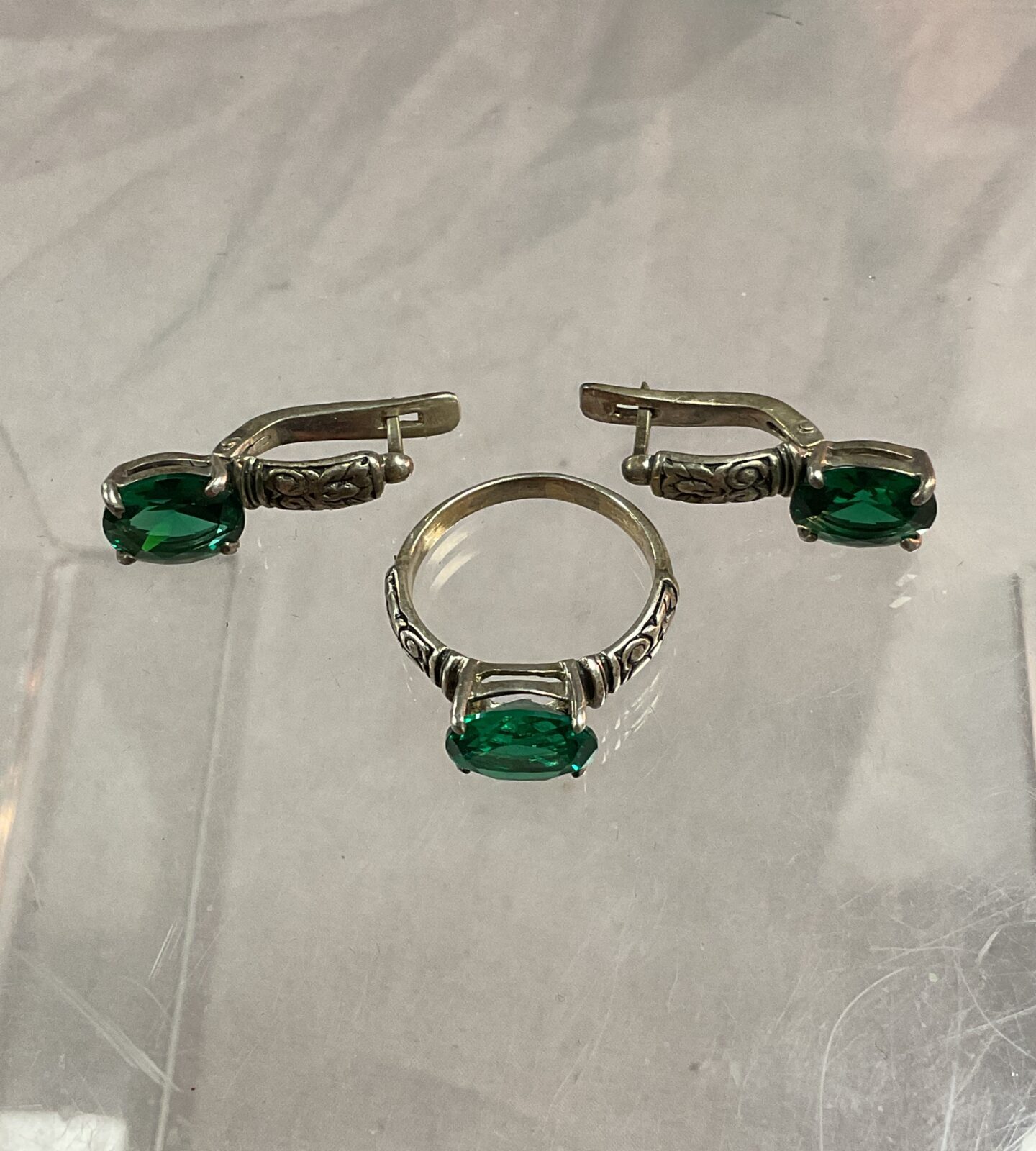 silver ring size  N with matching earrings set with green stone